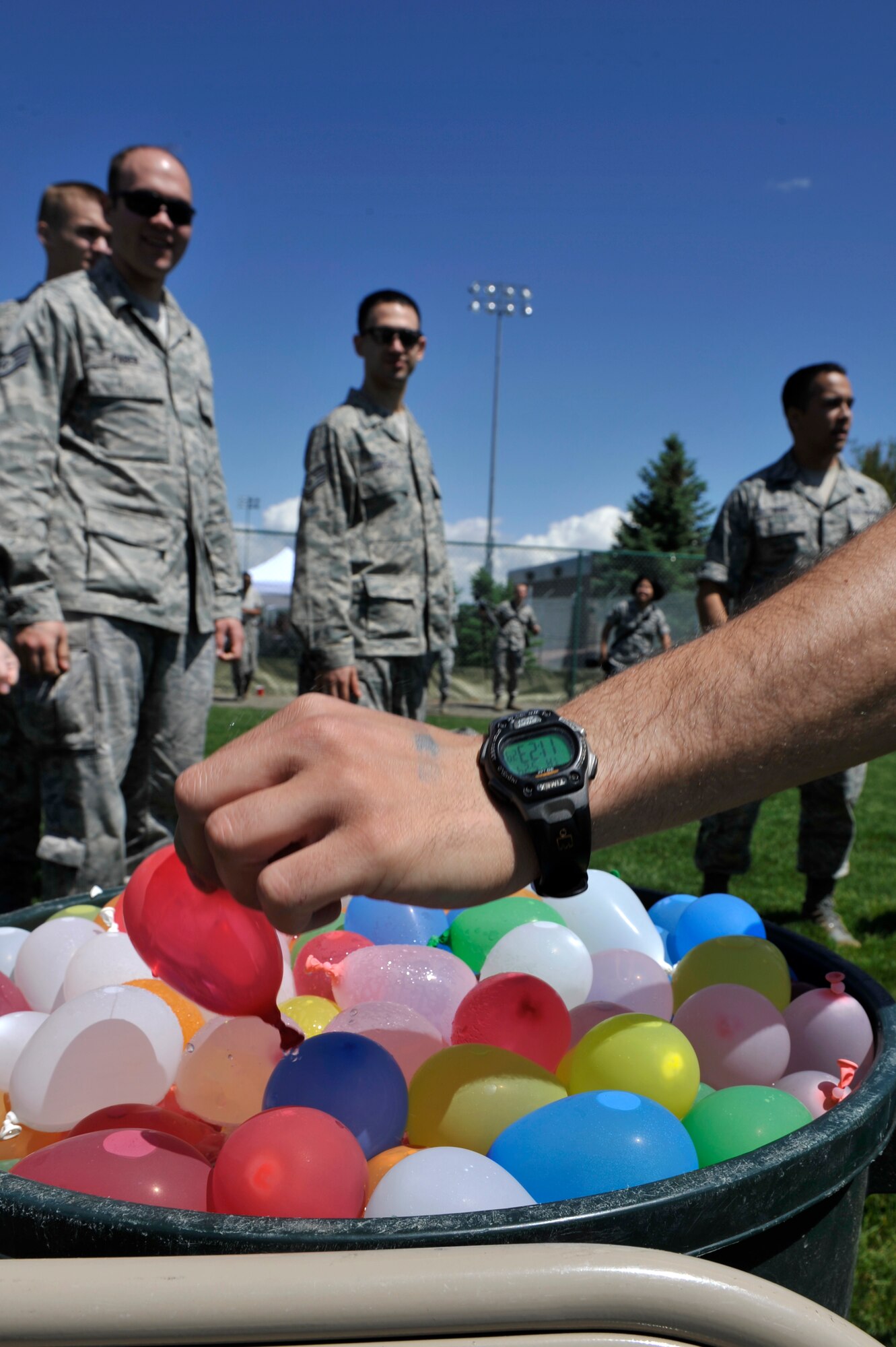 BUCKLEY AIR FORCE BACE, Colo. – Shown are some of the hundreds of water balloons thrown during a free-for-all here May 24, 2012. Team Buckley gathered at the softball fields in celebration of earning an “Excellent” for the recent Operational Readiness Inspection.  (U.S. Air Force photo by Airman 1st Class Riley Johnson) 