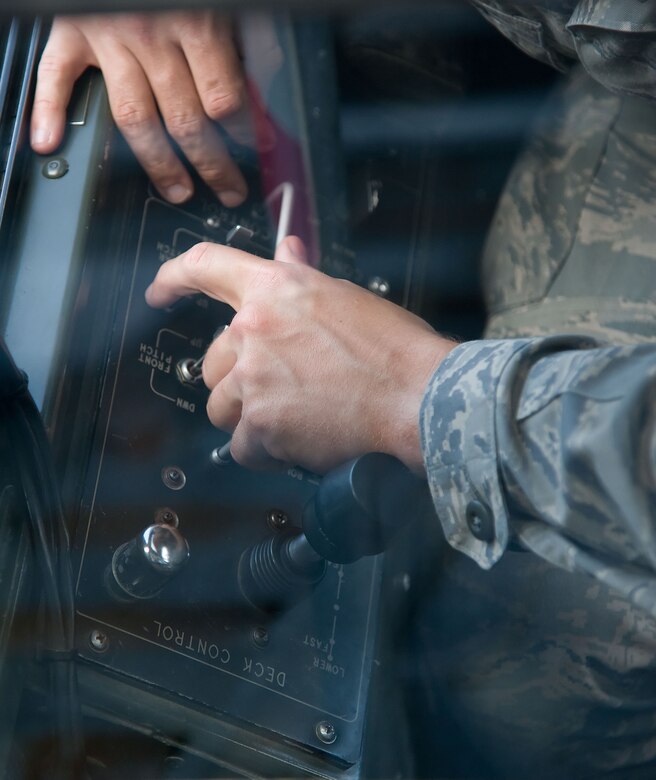 Controls ares manipulated on a “60K Tunner” K-loader May 24, 2012, at Dover Air Force Base, Del. The 436th Aerial Port Squadron is in charge of processing cargo that is then shipped across the world. (U.S. Air Force photo by Adrian R. Rowan)