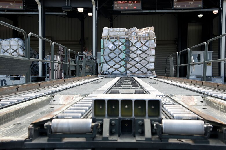 Pallets are loaded onto a “60K Tunner” K-loader May 24, 2012, at Dover Air Force Base, Del. The 436th Aerial Port Squadron is in charge of processing cargo that is then shipped across the world. (U.S. Air Force photo by Adrian R. Rowan)