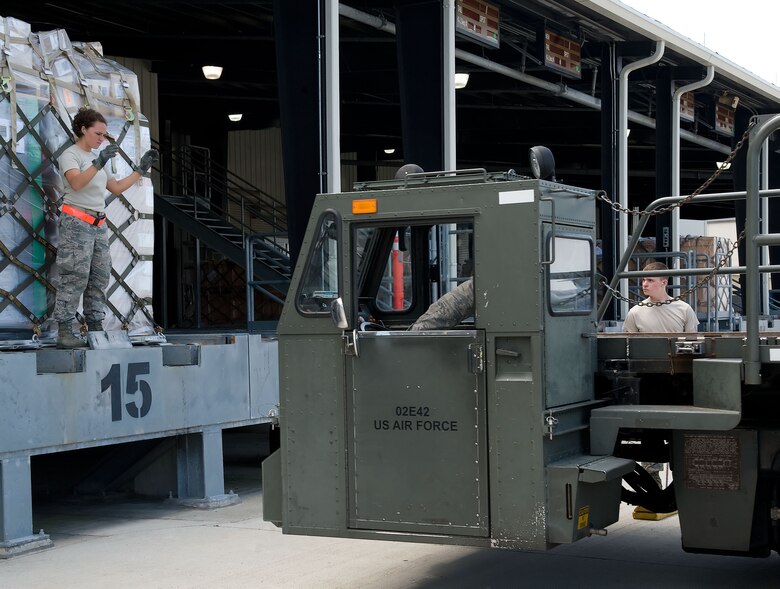 Senior Airman Maura Phillips, ramp services specialist with the 436th Aerial Port Squadron, lines up a “60K Tunner” K-loader May 24, 2012, at Dover Air Force Base, Del. The 436th APS is in charge of processing cargo that is then shipped across the world. (U.S. Air Force photo by Adrian R. Rowan)