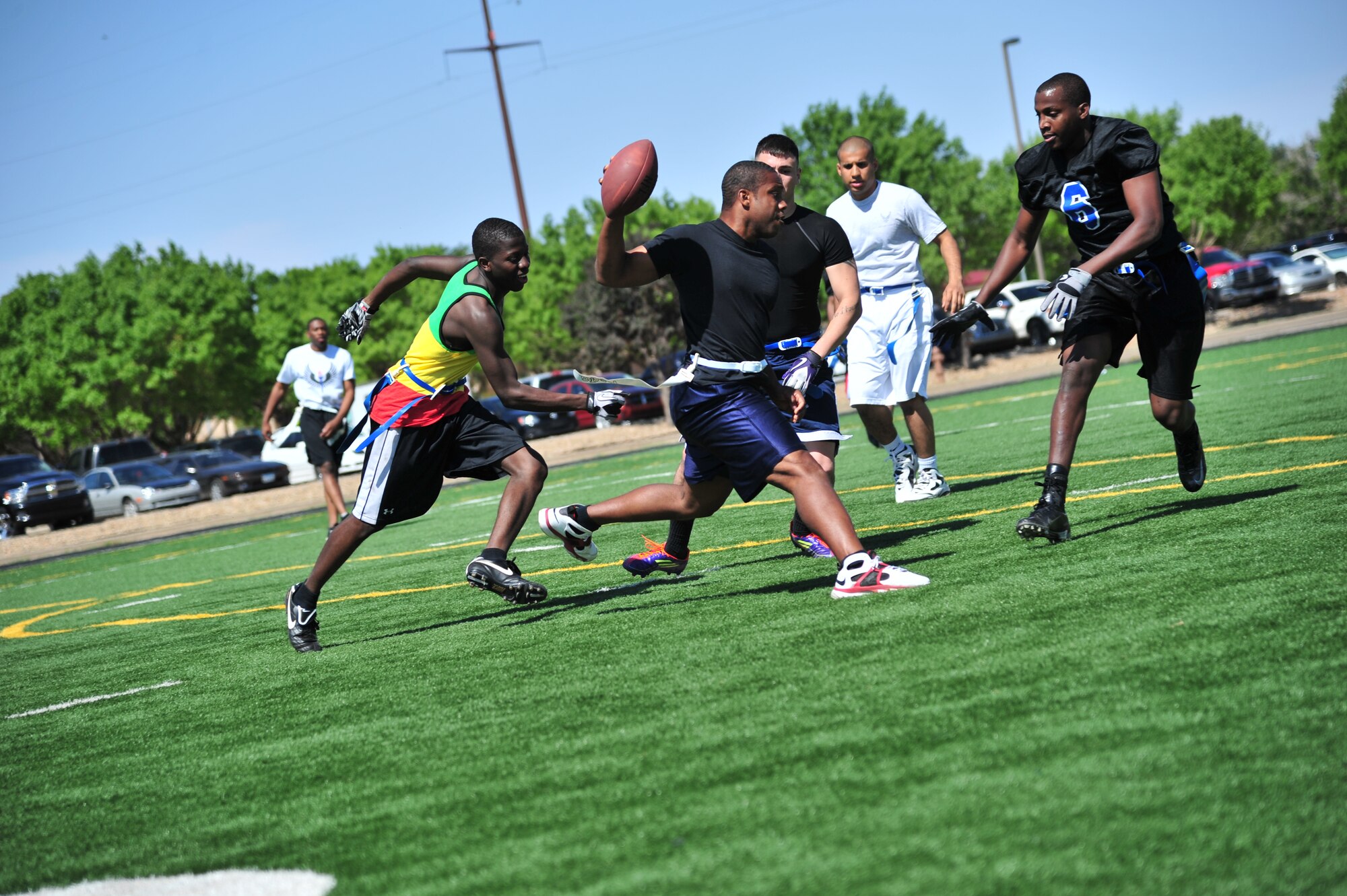 U.S. Air Force Airman 1st Class Jermon Nelson, 27th Special Operations Force Support Squadron food service apprentice, attempts a touch-down during Sports Day at Cannon Air Force Base, N.M., May 18, 2012.  Sports Day was a day for the base to assemble teams together and work toward winning a trophy in various sports activities.  (U.S. Air Force photo by Airman 1st Class Xavier Lockley)