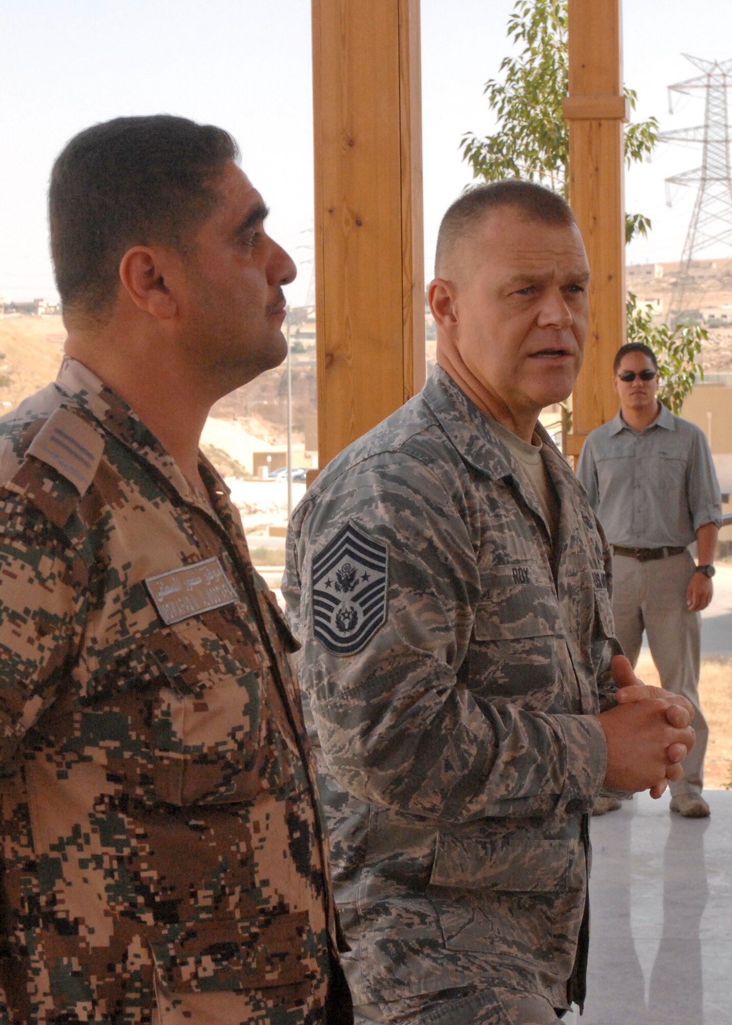 Chief Master Sgt. of the Air Force James A. Roy and Mowafaq Mohammad Al-Mostafa, chief master sergeant of the Royal Jordanian Air Force, address a mixed crowd of U.S airmen and coalition partners forward deployed to Jordan in support of Exercise Eager Lion 12 May 19, 2012, Amman, Jordan. Eager Lion 12 is a recurring, multinational exercise designed to strengthen military-to-military relationships and interoperability among 19 partner nations as they navigate scenarios simulating future complex national security challenges. (U.S. Air Force photo/1st Lt. Nicholas Mercurio)

