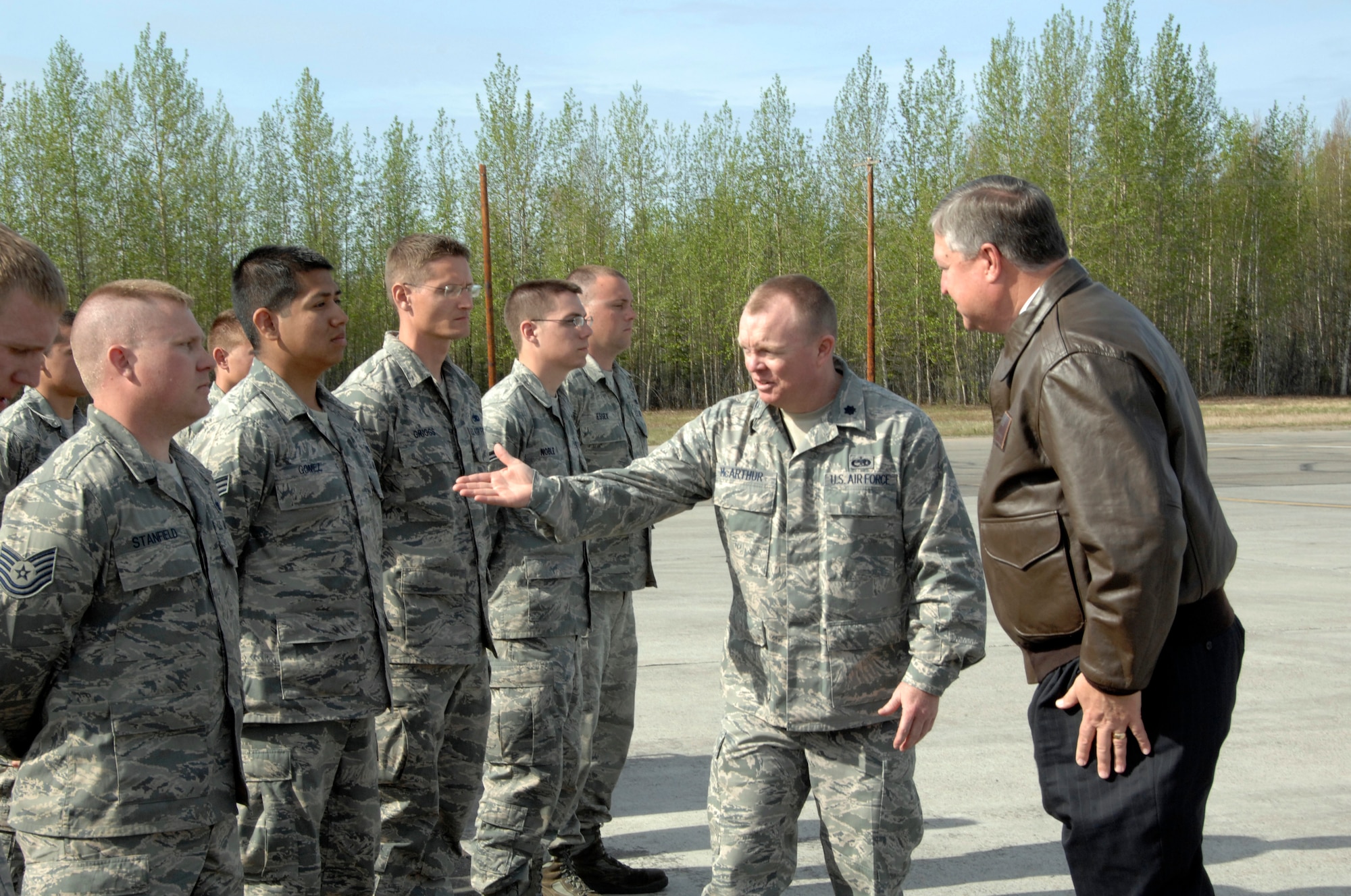 Lt. Col. James McArthur, 354th Aircraft Maintenance Squadron commander, introduces Secretary of the Air Force Michael Donley to aircraft maintainers during his visit May 22, 2012, Eielson Air Force Base, Alaska. In his speech to the Airmen, Donley noted that the aircraft on the ramp is a static display without the Airmen who bring it to life and turn it into a military capability for our Air Force and for the nation.  (U.S. Air Force photo/Master Sgt. Jason Vaught)

