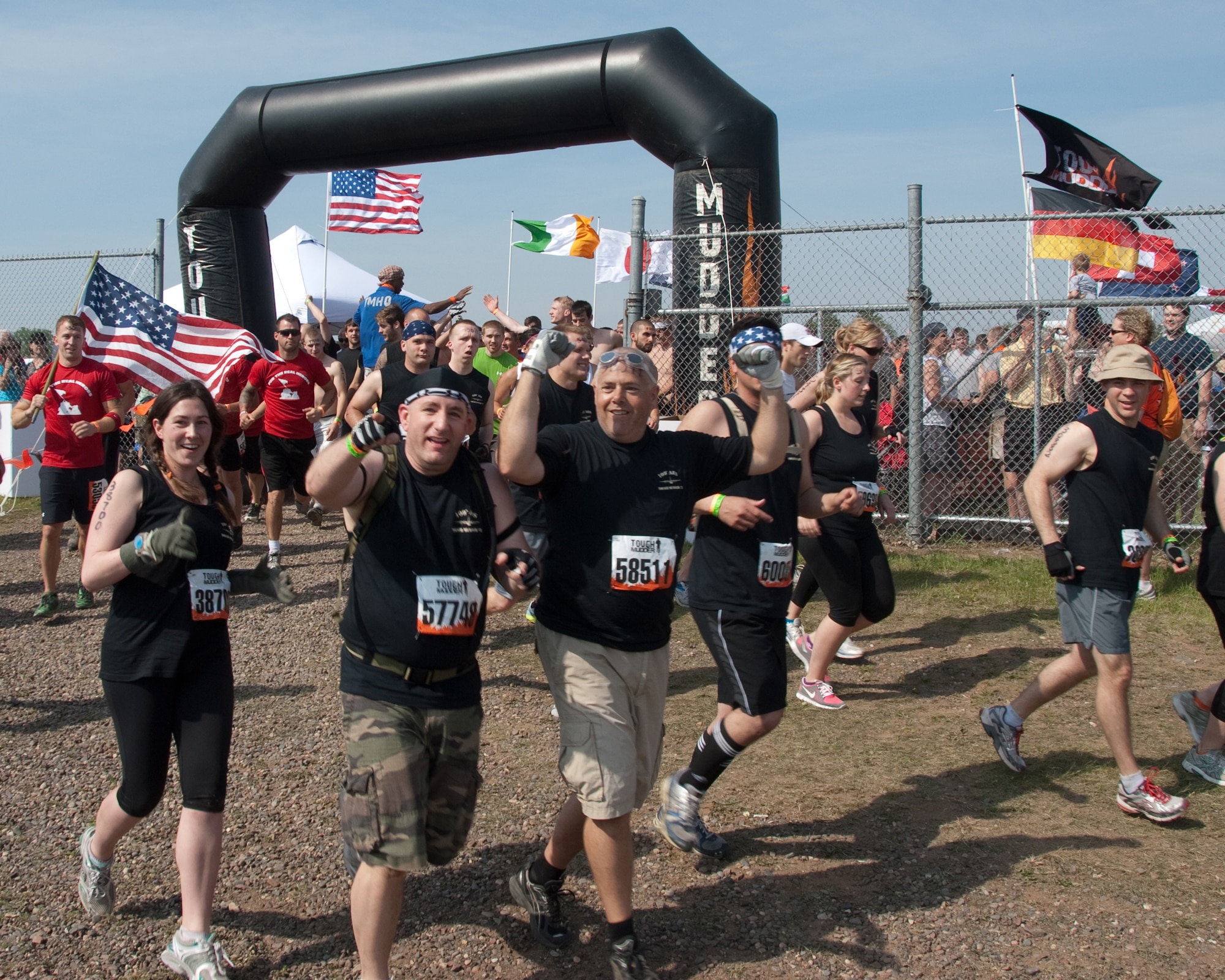 A team from the 109th Aeromedical Evacuation Squadron, Minnesota Air National Guard begins the Tough Mudder obstacle course in Somerset, Wis. with clean clothes and high spirits on May 19, 2012.  About a dozen Aeromeds made up one team and there were at least a dozen others from the 133rd Airlift Wing getting muddy for exercise, camaraderie, and to help raise money for the Wounded Warrior project.  U.S. Air Force Photo by Staff Sgt. Jonathan Young