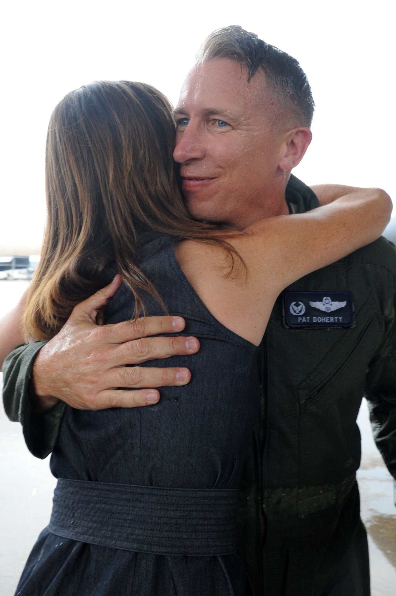 Col. Patrick Doherty hugs his wife, Dee Dee, after completing his final flight in an F-15E Strike Eagle as the 4th Fighter Wing commander on Seymour Johnson Air Force Base, N.C., May 23, 2012. Doherty will relinquish command of the 4th FW to Col. Jeannie Leavitt in a change-of-command ceremony, June 1. (U.S. Air Force photo/Airman 1st Class Aubrey Robinson/Released)