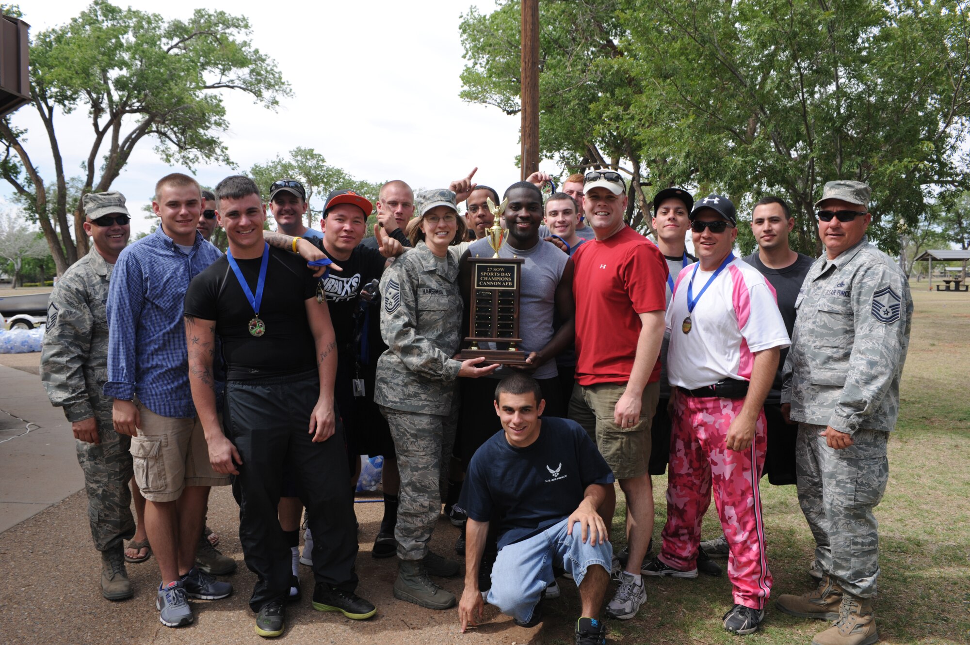 Members from the 27th Special Operations Aircraft Maintenance Squadron pose with the Cannon Air Force Base Sports Day championship trophy at Unity Park on base, N.M., May 18, 2012.  The 27 SOAMXS won first place in bowling, football, softball and tug-of-war.  (U.S. Air Force photo by Senior Airman James Bell)