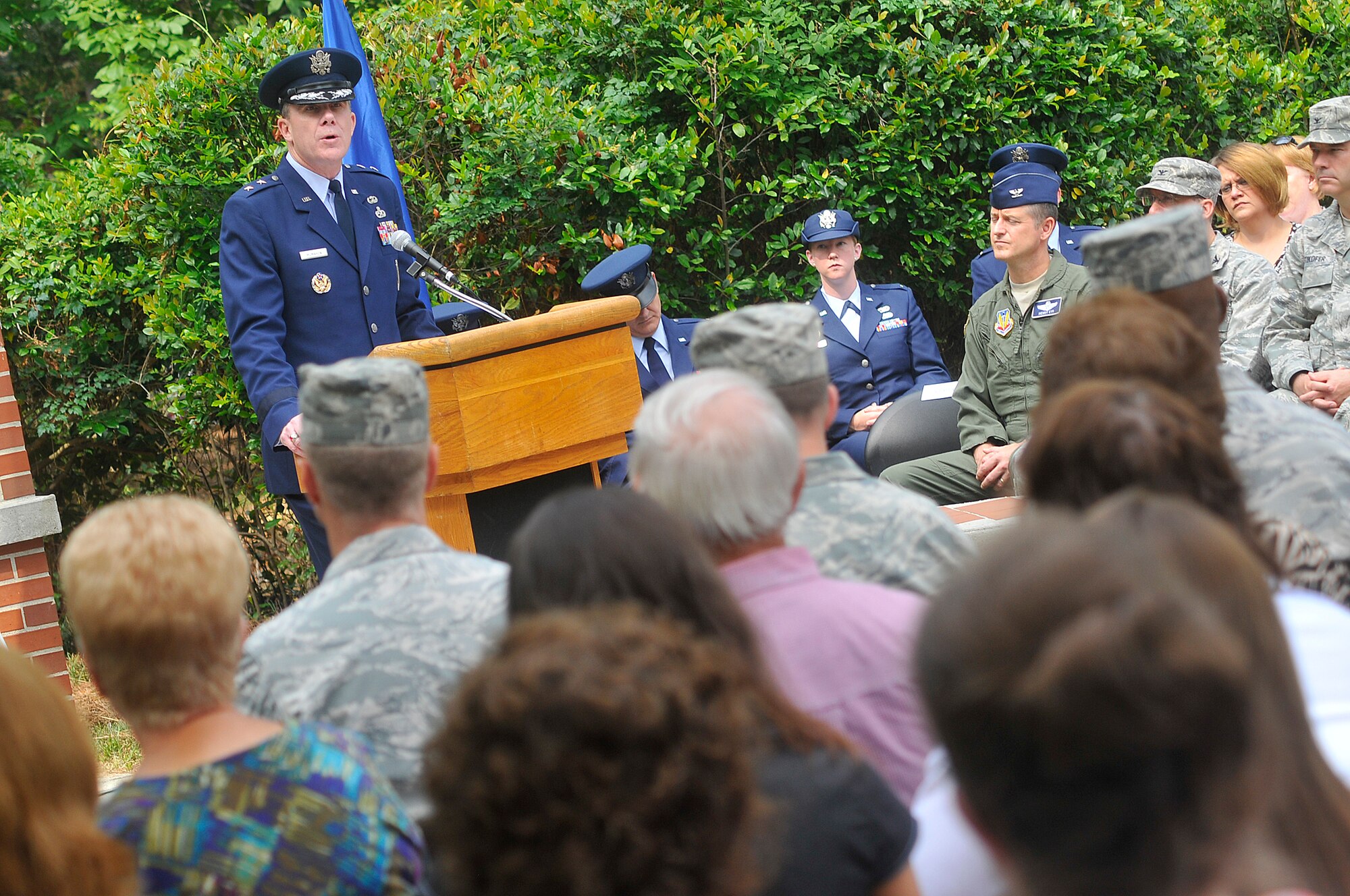 Maj. Gen Robert McMahon give the memorial address at the Camellia Garden Memorial Service Thursday. The service paid tribute to the memory of 51 departed Team Robins members.  (U. S. Air Force photo by Sue Sapp)
