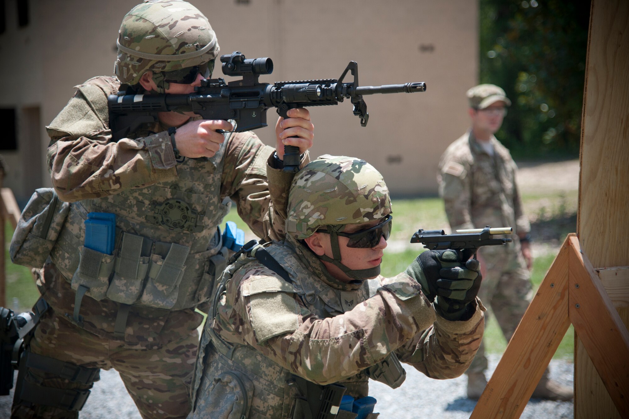 U.S. Air security forces Force Airmen participate in a shoot, move and communicate drill at Moody Air Force Base, Ga., May 23, 2012. Airmen from bases including Holloman, Davis-Monthan, Langley and Nellis Air Force Bases visited Moody to train in preparation for a deployment to Afghanistan with the 824th Base Defense Squadron. (U.S. Air Force photo by Airman 1st Class Paul Francis/Released)
