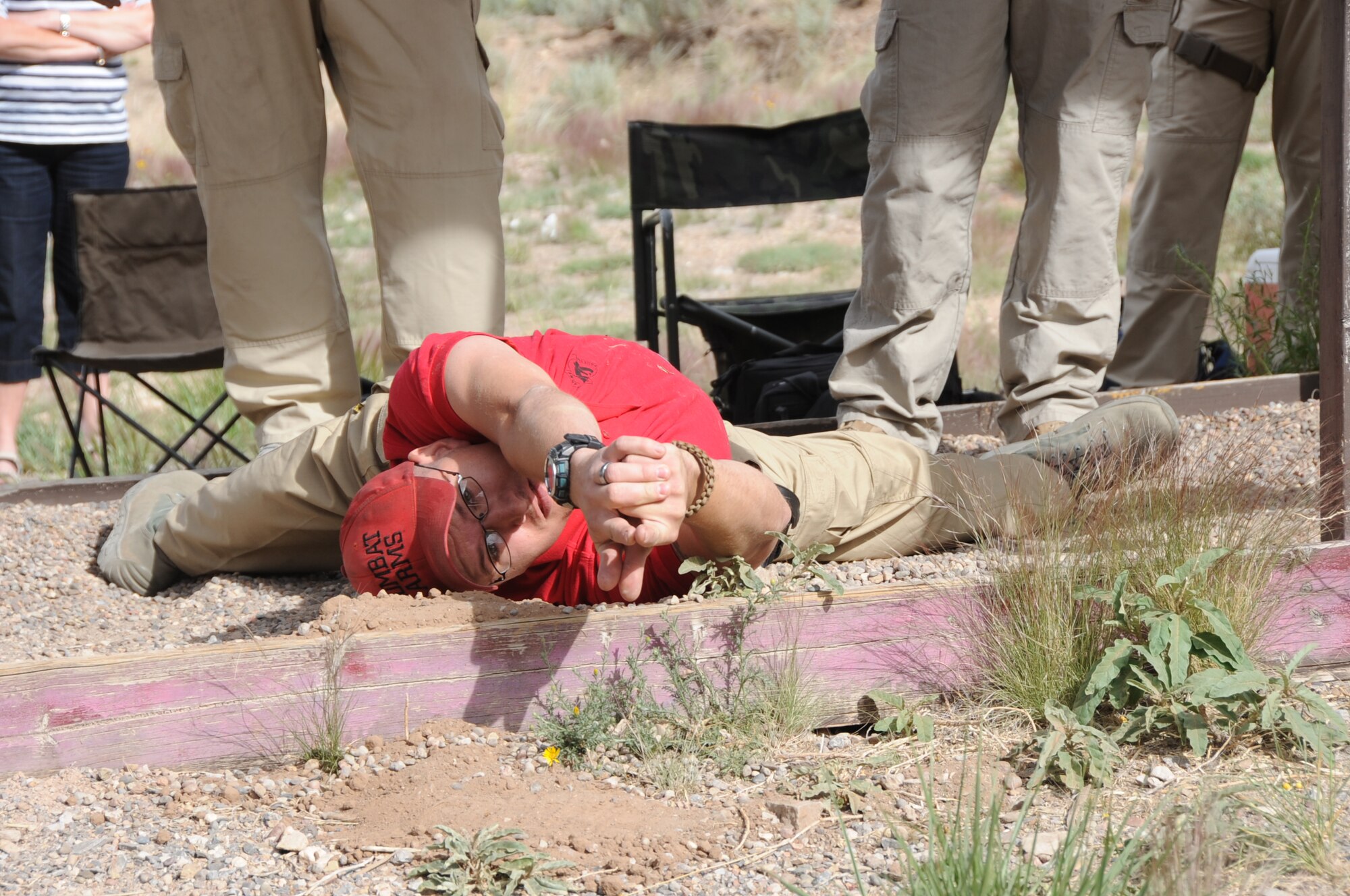 KIRTLAND AFB, N.M. -- Staff Sgt. Dustin Walker, 377th Security Forces Group Combat Arms instructor, demonstrates a shooting position May 18 during the Police Week shooting competition. (Photo by Dennis Carlson)