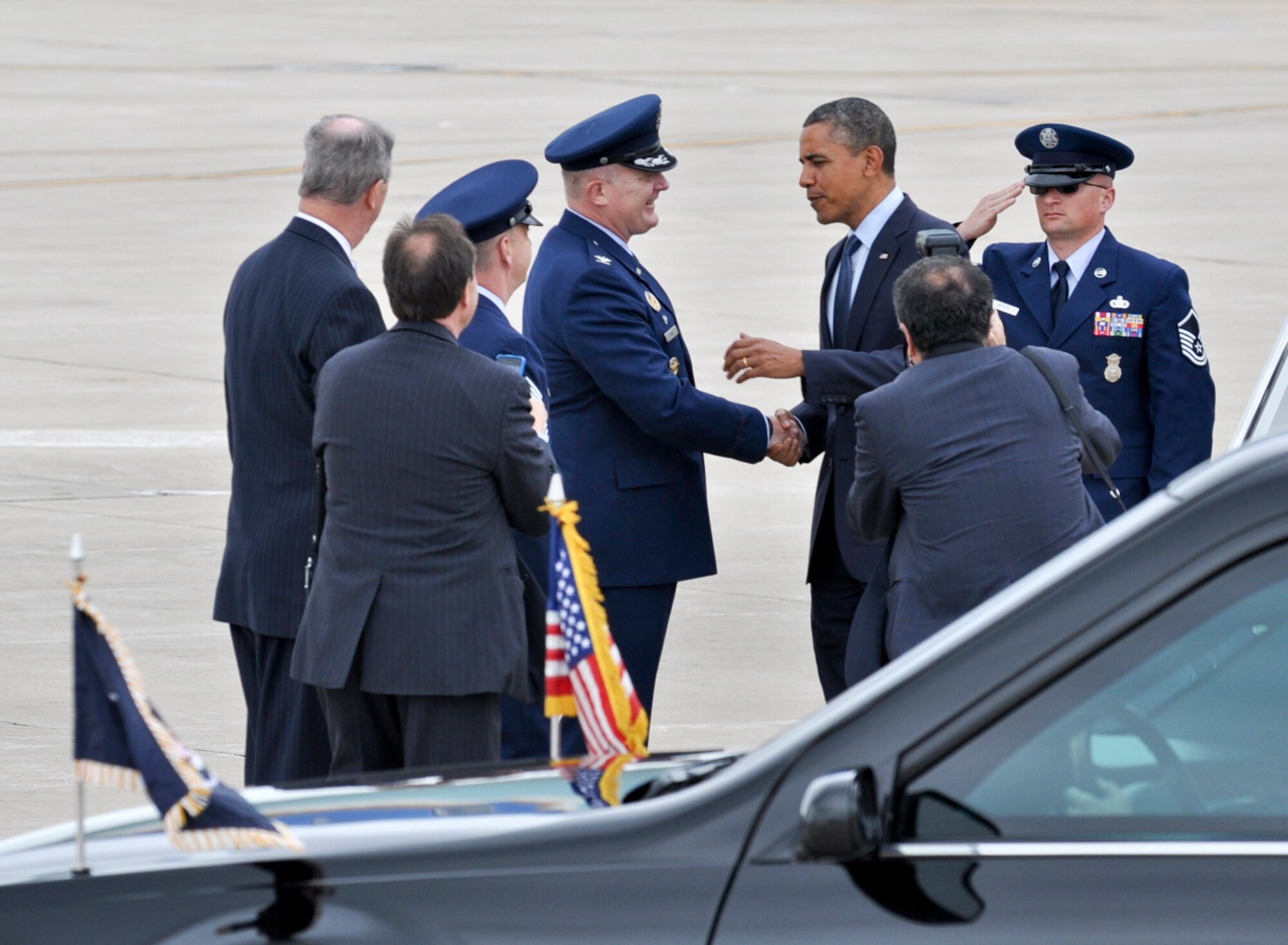 BUCKLEY AIR FORCE BASE, Colo. -- President Barack Obama is greeted by Col. Daniel Dant, 460th Space Wing commander, and Chief Master Sgt. William Ward, 460th SW command chief, after landing here May 23, 2012. Obama was escorted to downtown Denver where he made a public appearance. (U.S. Air Force photo by Senior Airman Christopher Gross)