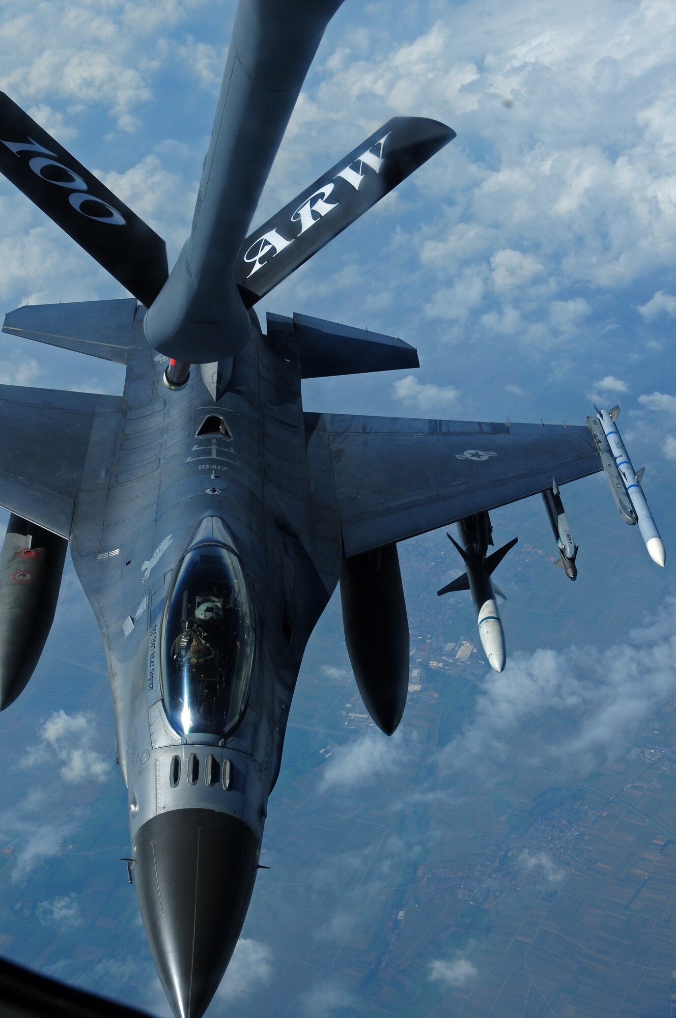 SPANGDAHLEM AIR BASE, Germany – An 480st Fighter Squadron F-16 Fighting Falcon pilot lines up the aircraft to be refueled during an orientation flight for 25 52nd Fighter Wing Airmen and spouses here May 23. The Airmen and spouses flew on a 351st ARS KC-135 stationed out of RAF Mildenhall during an in-flight refueling of 81st and 480th Fighter Squadron aircraft from Spangdahlem AB. The 351st ARS and 52nd FW aircrew train together to enhance their interoperability to perform in-flight refueling missions. (U.S. Air Force photo by Airman 1st Class Matthew B. Fredericks/Released)