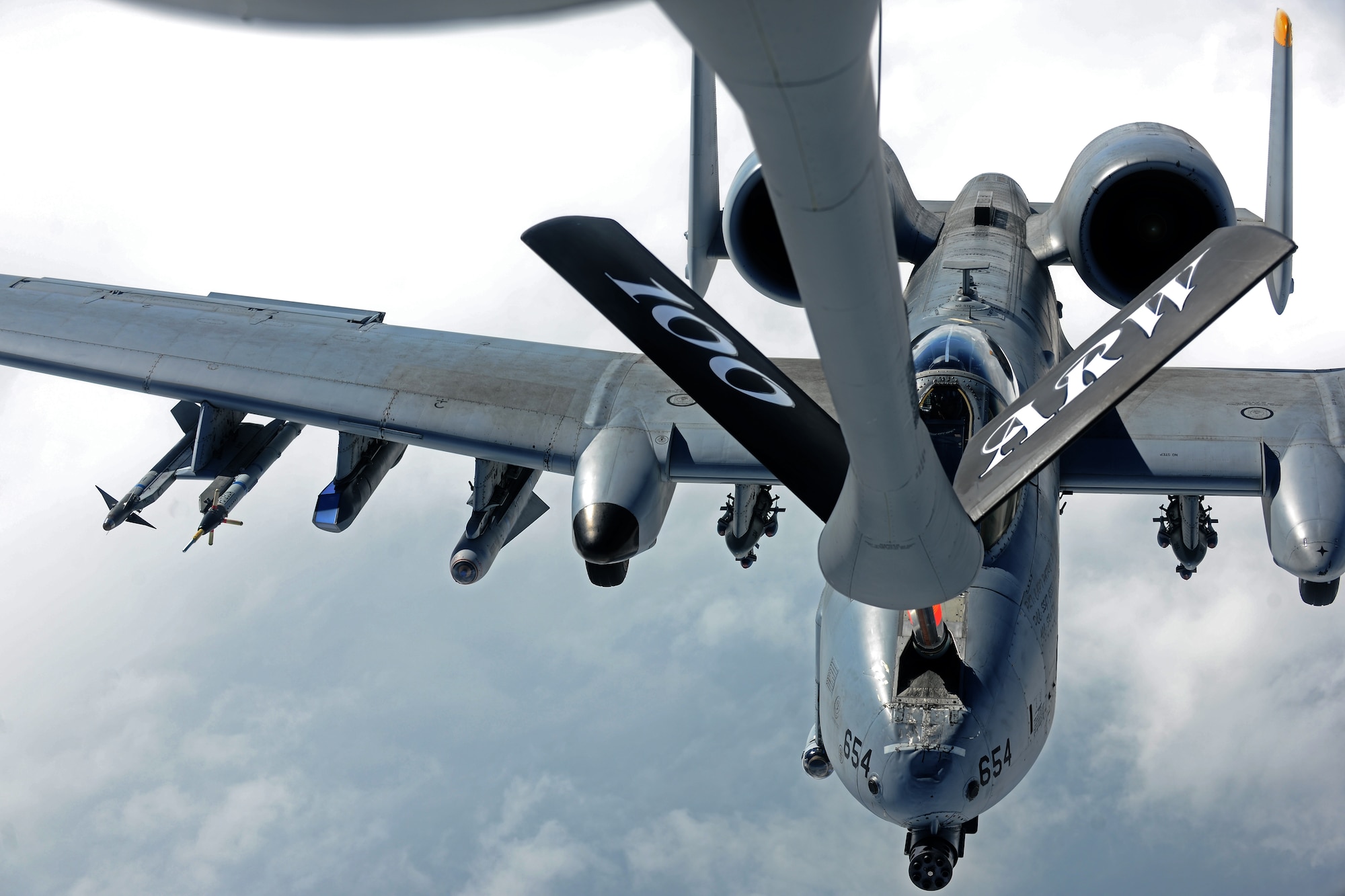 SPANGDAHLEM AIR BASE, Germany – An A-10 Thunderbolt II pilot from the 81st Fighter Squadron lines up the aircraft to be refueled during an orientation flight for 25 52nd Fighter Wing Airmen and spouses here May 23. The Airmen and spouses flew on a 351st ARS KC-135 stationed out of Royal Air Force Mildenhall, England during an in-flight refueling of 81st and 480th Fighter Squadron aircraft from Spangdahlem AB. The 351st ARS and 52nd FW aircrew train together to enhance their interoperability to perform in-flight refueling missions. (U.S. Air Force photo by Airman 1st Class Matthew B. Fredericks/Released)