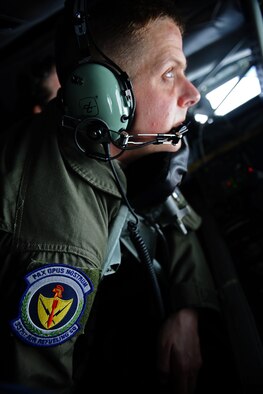 SPANGDAHLEM AIR BASE, Germany – Staff Sgt. Thomas Vesser, 351st Air Refueling Squadron in flight refueler, operates a boom to refuel aircraft during an orientation flight for 25 52nd Fighter Wing Airmen and spouses here May 23. The Airmen and spouses flew on a 351st ARS KC-135 stationed out of RAF Mildenhall during an in-flight refueling of 81st and 480th Fighter Squadron aircraft from Spangdahlem AB. The 351st ARS and 52nd FW aircrew train together to enhance their interoperability to perform in-flight refueling missions. (U.S. Air Force photo by Airman 1st Class Matthew B. Fredericks/Released)