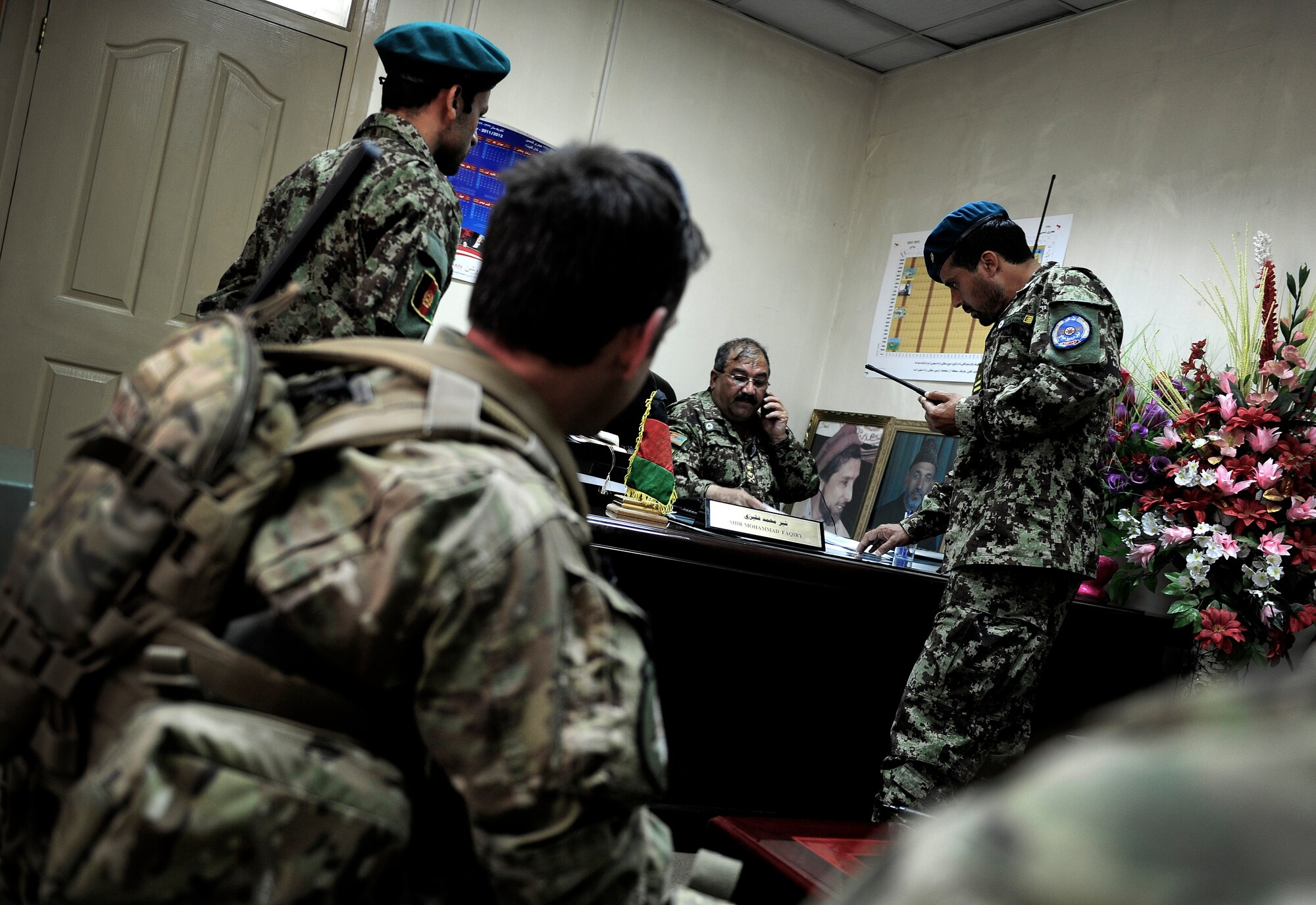 Air Force Security Forces members from the 439th Air Expeditionary Advisor Squadron, advise members of the Afghan Air Force regarding a  mounted and dismounted patrol in Kabul, Afghanistan, May 21, 2012. The mission marked the first time AAF security force members led in a reaction force patrol. (U.S. Air Force photo/Staff Sgt. Clay Lancaster)