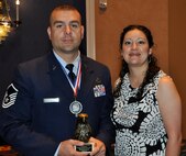 PETERSON AIR FORCE BASE, Colo. Master Sgt. Lawrence M. Prieto poses with his wife, Joy, following the 2012 Armed Forces Luncheon May 18 at the Broadmoor resort International Center, Colorado Springs, Colo. Prieto, an Air Force Reservist, is a Vehicle Operations Supervisor and acting First Sergeant for the 302nd Airlift Wing’s Logistic Readiness Squadron here. As one of five locally stationed military members nominated in the senior enlisted category Prieto received a trophy and medal from Army Gen. Charles H. Jacoby, Jr., Commander of the North American Aerospace Defense Command and U.S. Northern Command during the annual Armed Forces Week event. (U.S. Air Force photo/Tech Sgt. Daniel Butterfield)