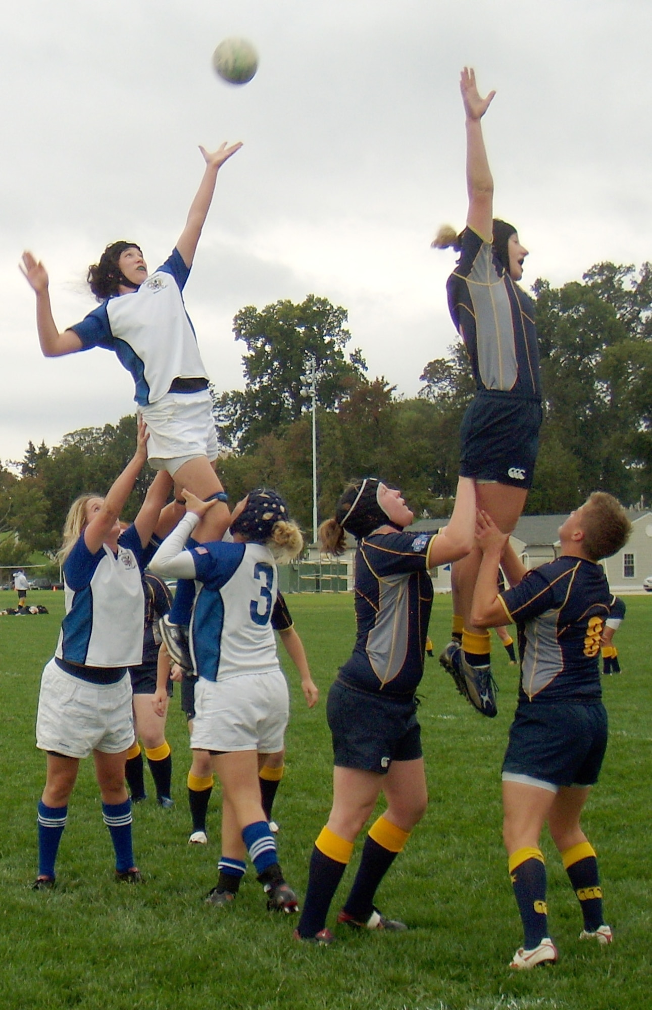 Theresa Cameron battles an opposing jumper for the ball off a lineout during the Air Force-Navy women's rugby match Oct. 1, 2011. Cameron plays second row for the Air Force team. (U.S. Air Force photo)