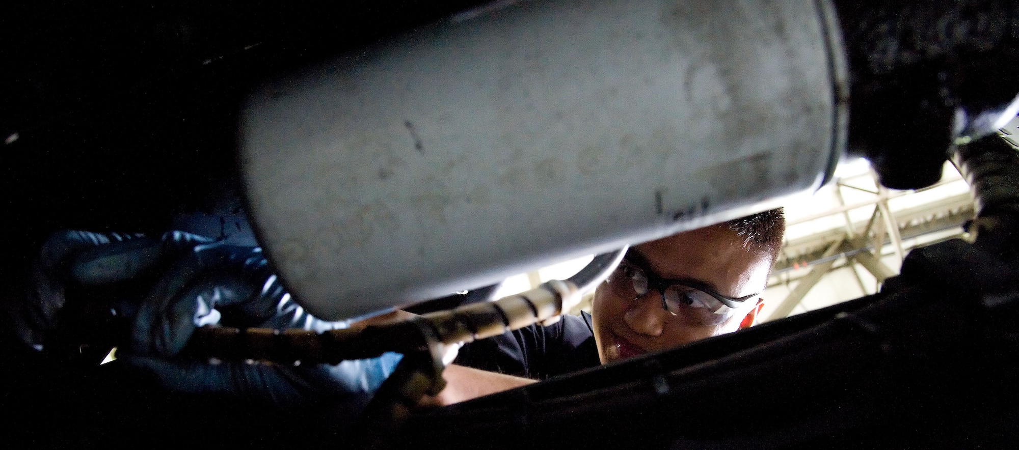 Airman 1st Class Julian Cardenas, an aerospace ground equipment mechanic with the 436th Maintenance Squadron, affixes a chafing guard to a generator May 23, 2012, at Dover Air Force Base, Del. The Aerospace Ground Equipment Flight is responsible for maintaining the majority of aircraft maintenance equipment on the flightline. (U.S. Air Force photo by Adrian R. Rowan)