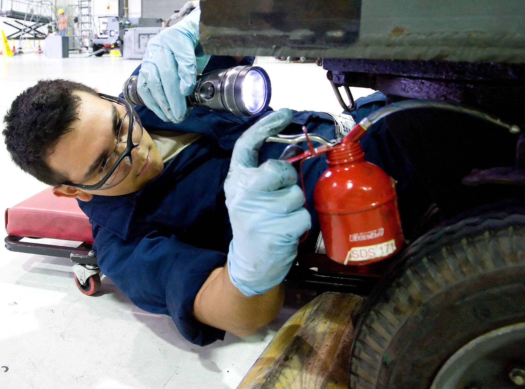 Senior Airman Niko Medina-Portillo, an apprentice aerospace ground equipment mechanic with the 512th Maintenance Squadron, oils a generator May 23, 2012, at Dover Air Force Base, Del. The Aerospace Ground Equipment Flight is responsible for maintaining the majority of aircraft maintenance equipment on the flightline. (U.S. Air Force photo by Adrian R. Rowan)