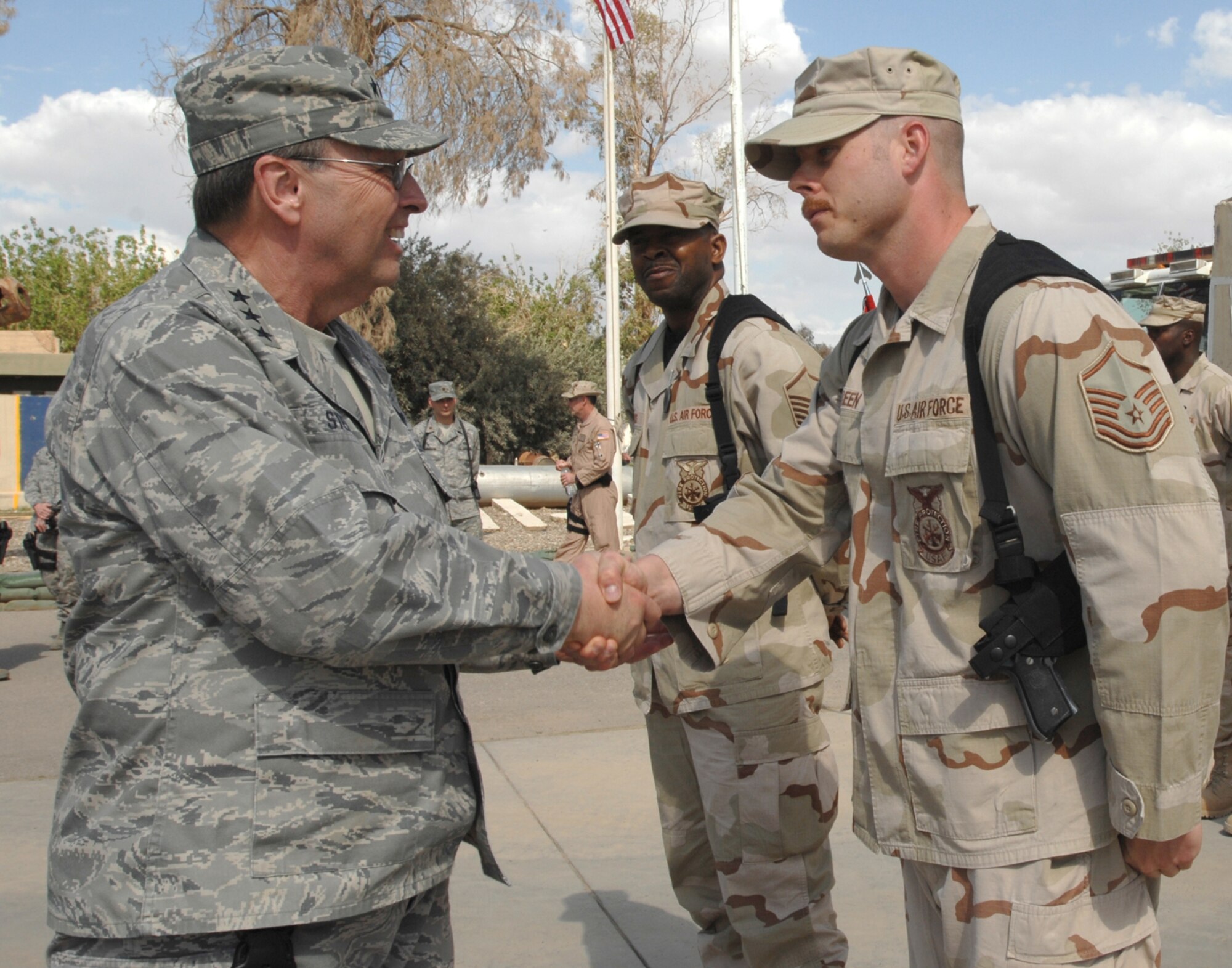 Master Sgt. Jacob Green, a deployed Reservist from the 446th Civil Engineer Squadron, McChord Air Force Base, Wash., greets Stenner during the general's visit to Kirkuk Regional Air Base, Iraq, in 2009. (Staff Sgt. Eunique P. Stevens)