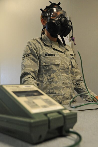 Airman 1st Class Lisa Newman, 2nd Logistics Readiness Squadron, conducts breathing exercises during a gas mask fit test on Barksdale Air Force Base, La., May 23. Due to the sensitivity of the Portacount Plus machine, Airmen are advised to refrain from chewing gum, eating or drinking before they take the test. (U.S. Air Force photo/Airman 1st Class Micaiah Anthony)(RELEASED)