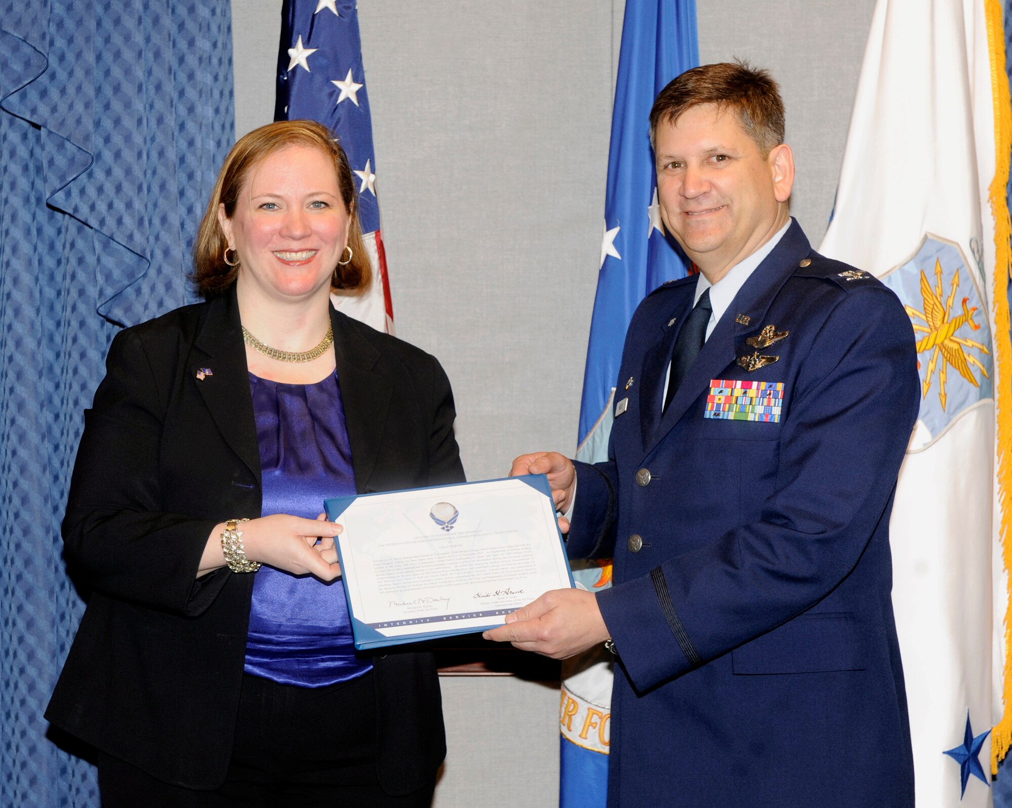 Under Secretary of the Air Force Erin Conaton presents the Air Force's
International Affairs Excellence Award to Col. Lee Harvis during a ceremony
held in the Pentagon in Washington, D.C., on May 23, 2012.  Harvis currently
commands the 374th Medical Group at Yokota Air Base, Japan.  (U.S. Air Force
photo/Andy Morataya)
