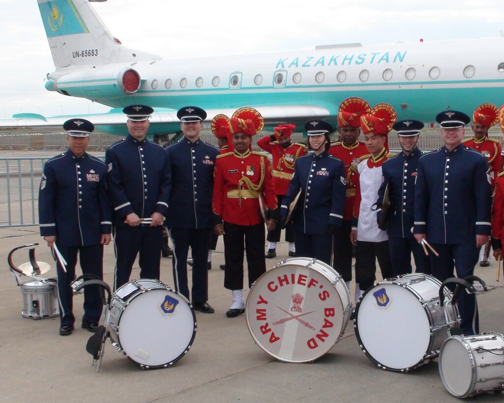 Members of the USAFE Band's drumline photographed with the drumline from an Indian military band prior to a pass and review parade for the President  and Prime Minister of Kazakhstan.