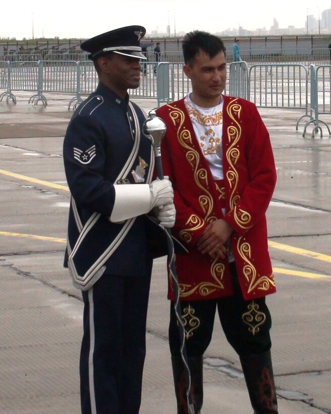 SSgt Jerome Minor pauses for a moment for a photo with a bandsman from a unit in Tajikistan.