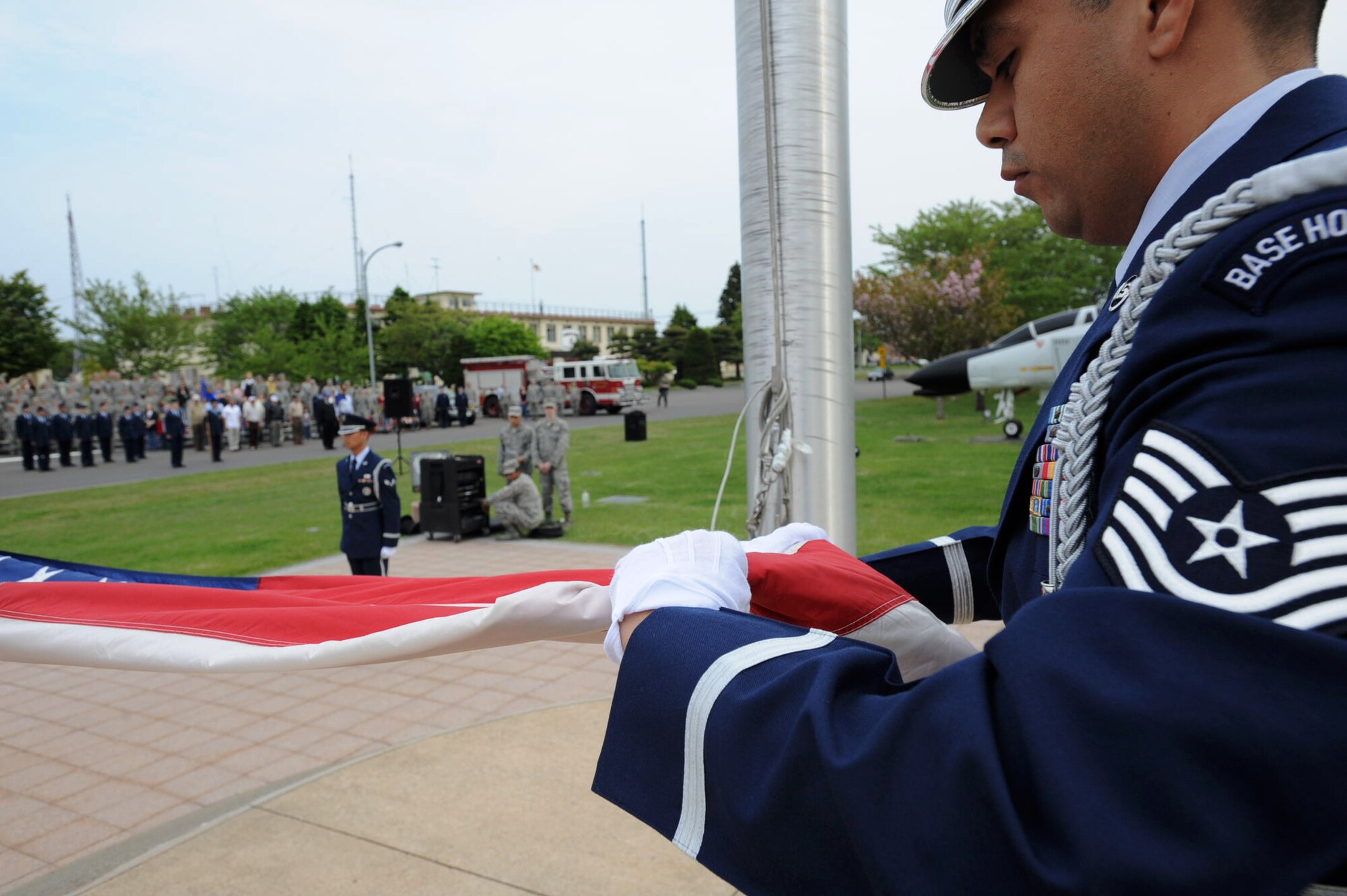 U.S. Air Force Honor Guard folds the American flag during a Memorial Day retreat ceremony at Misawa Air Base, Japan, May 24, 2012. Active-duty and retired servicemembers stationed on base stood in formation at Risner Circle while honoring the memory of the nation’s fallen. (U.S. Air Force photo by Airman Kenna Jackson/Released)