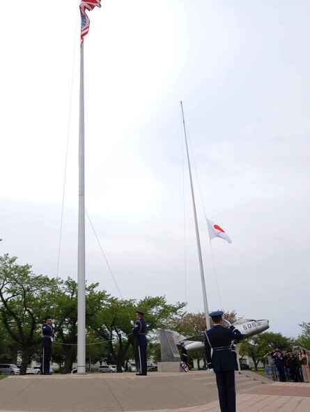U.S. Air Force Honor Guard and Japan Air Self-Defense Force members lower the flags at Risner Circle during a Memorial Day retreat ceremony at Misawa Air Base, Japan, May 24, 2012. The ceremony gave Airmen, Sailors, Soldiers and community members the opportunity to honor U.S. servicemembers who have fallen in defense of the U.S. nation. Memorial Day was originally called Decoration Day and began May 30, 1868. (U.S. Air Force photo/Airman Kenna Jackson/Released) 
