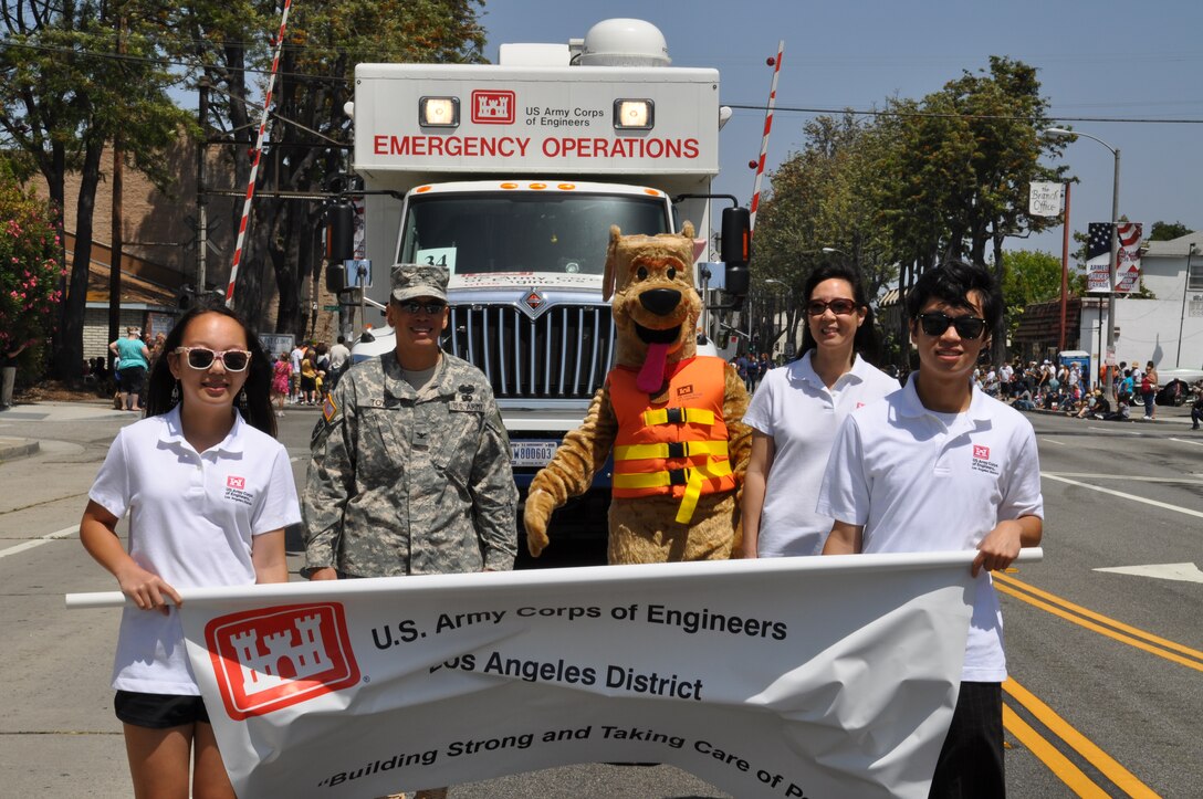 CALIFORNIA — The U.S. Army Corps of Engineers Los Angeles District's new Emergency Command and Control Vehicle, operated by Alex Watt, made its debut appearance at the city of Torrance's 53rd Annual Armed Forces Day Celebration May 19 and was led by the District's commander, Col. Mark Toy, wife May, daughter Kayla and son Brandon. The Toys carried the District's banner, followed by the ECCV, Fany Anderson of the District's safety office and Bobber the Water Safety Dog, along the two-mile parade route.
