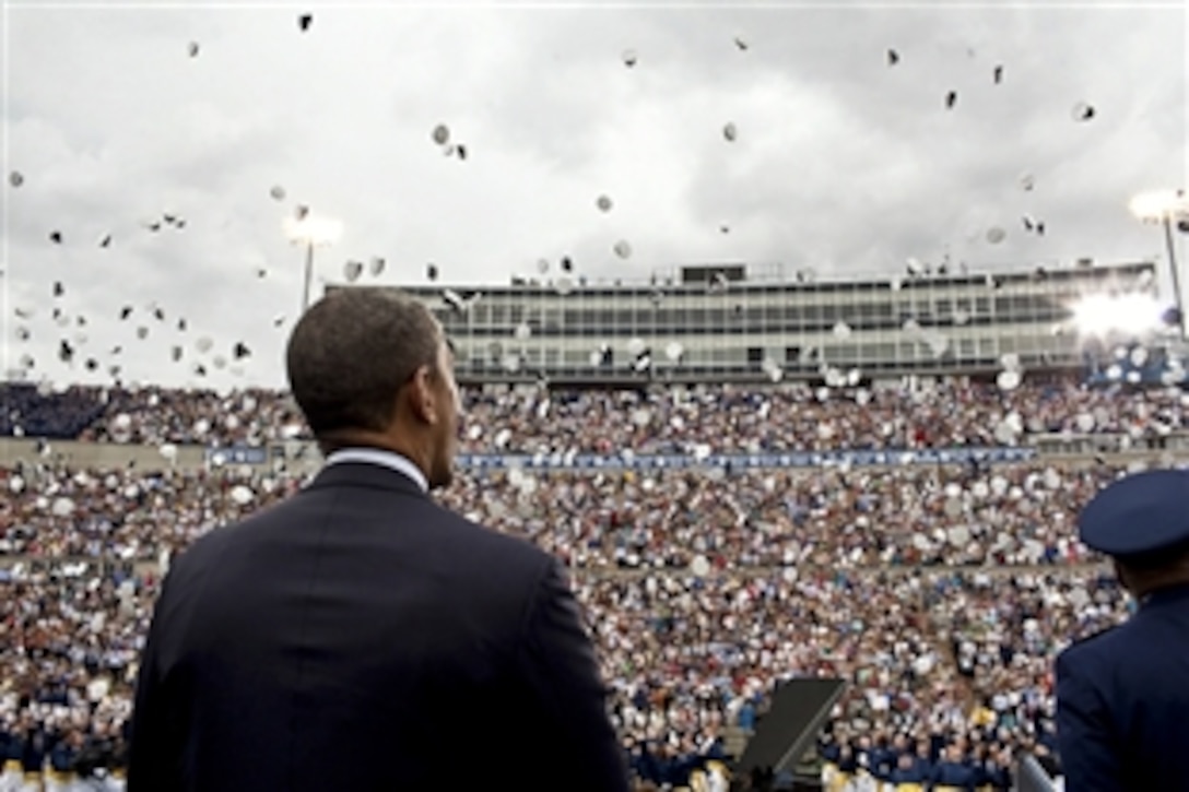 President Barack Obama watches as graduates toss their hats after he spoke at the commencement ceremony for the U.S. Air Force Academy in Colorado Springs, Colo., May 23, 2012.