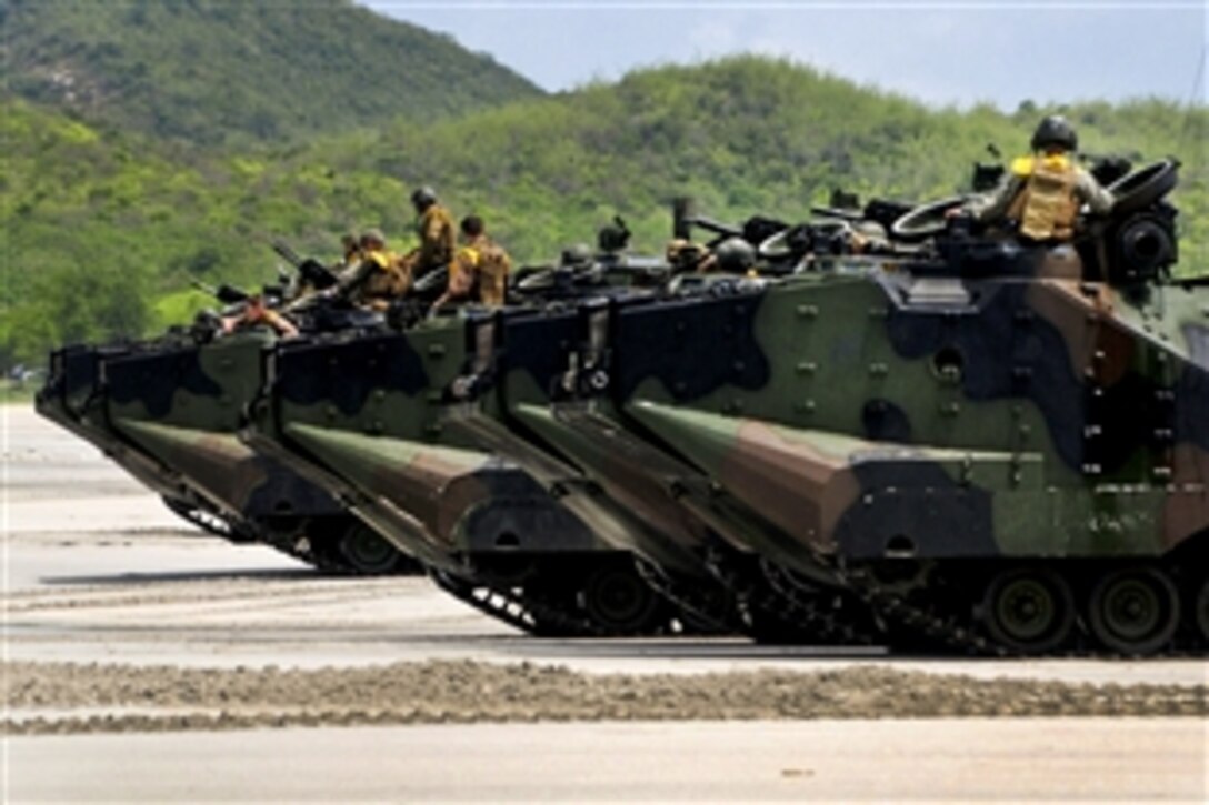 Thai and U.S. Marines assemble amphibious assault vehicles on the beach for a simulated assault during Cooperation Afloat Readiness and Training Thailand 2012 in Hat Yao, Thailand, May 23, 2012.