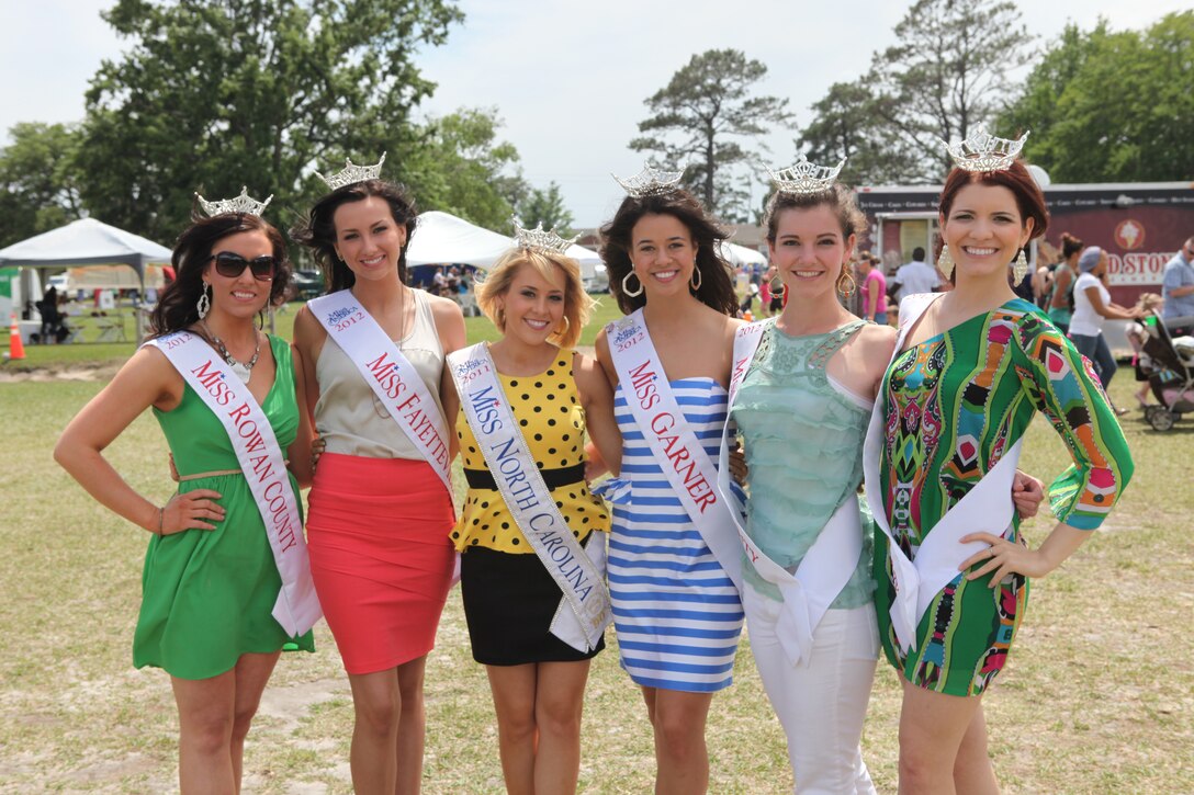 Pageant winners from counties in North Carolina pose for a photo at the annual Maynia carnival, during their visit to show appreciation for service members and their families sacrifices aboard Camp Lejeune May 19.