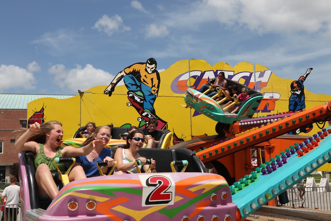 The Catch'N Air  carnival ride gives young teens a thrill during the annual Maynia festivities at W.P.T. Hill Field aboard Camp Lejeune May 19.