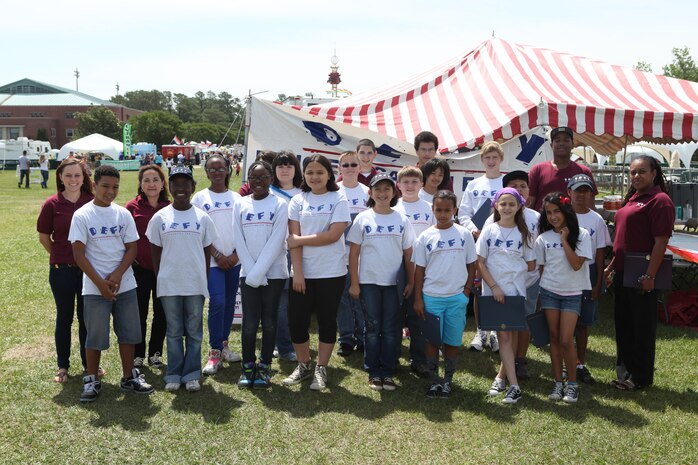 Mentors and teen members of the Drug Education for Youth program pose for a photo after their Phase II graduation ceremony during the Maynia festivities at W.P.T. Hill Field abaord Marine Corps Base Camp Lejeune May 19.