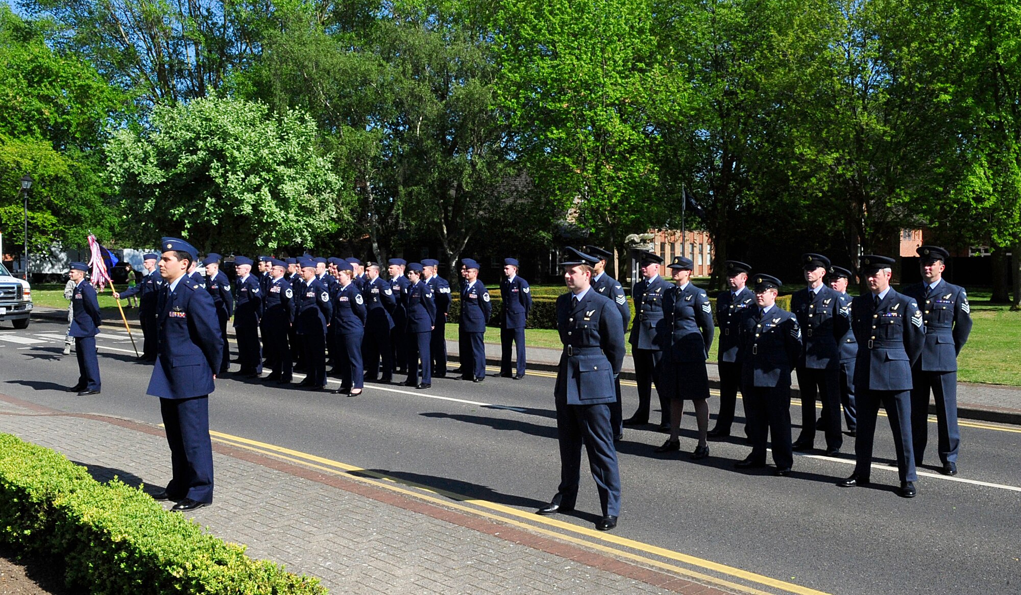RAF MILDENHALL, England – Team Mildenhall Airmen from the 488th Intelligence Squadron and 95th Reconnaissance Squadron and British airmen from the 51 Squadron, Royal Air Force Waddington, participate in a retreat ceremony here, May 25, 2012. The 51 Sq. and the 488th IS are sister squadrons and routinely train together. (U.S. Air Force photo/Senior Airman Ethan Morgan)  
