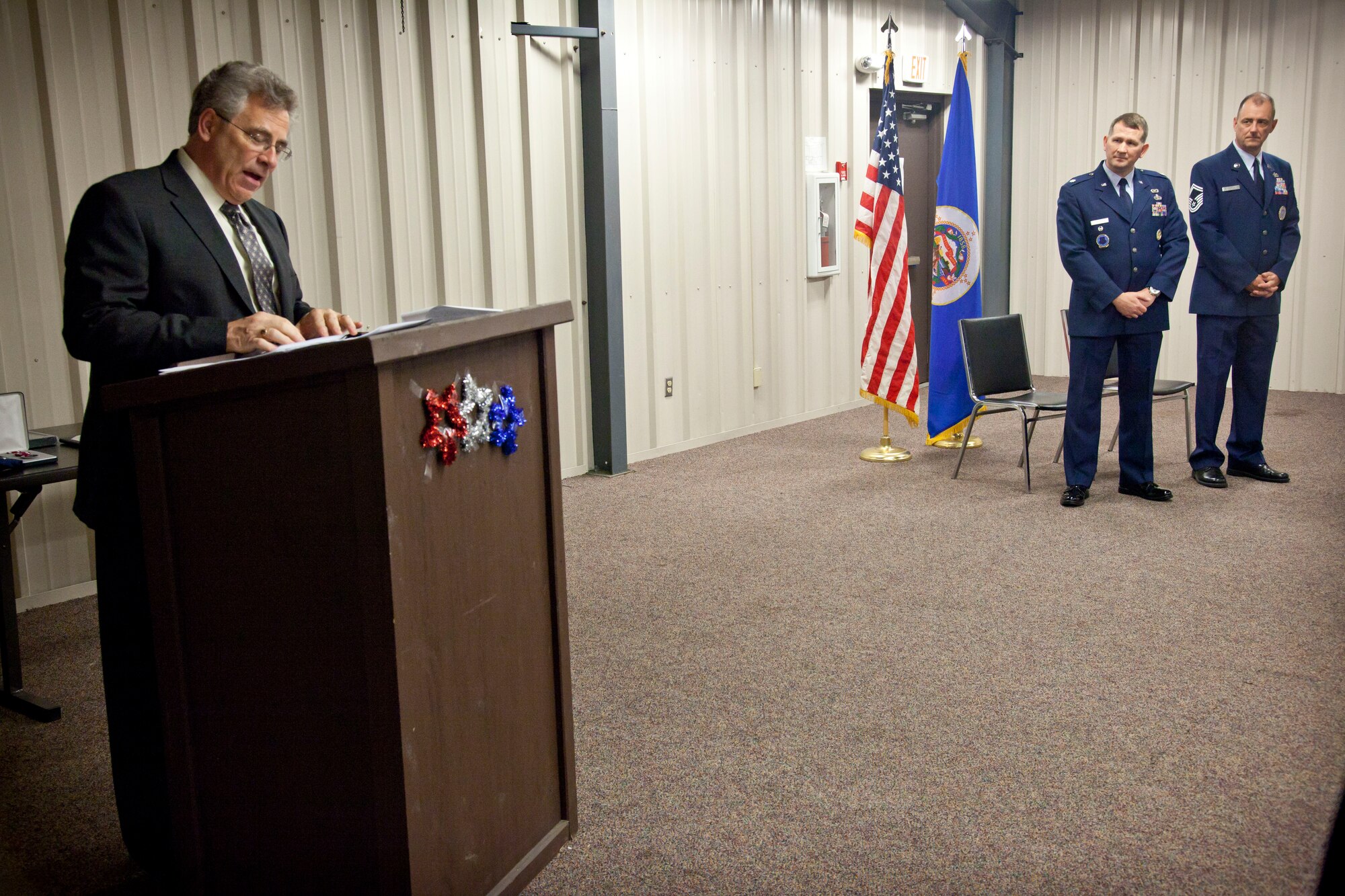Pastor John Matthews says the Benediction at Senior Master Sgt. Gerald Sutherland's retirement ceremony.  Sergeant Sutherland retires after 27 years of military service his last post being Senior Recruiter for the 934th Airlift Wing at Minneapolis-St. Paul Air Reserve Station, Minn.  (U.S. Air Force Photo/Shannon McKay)