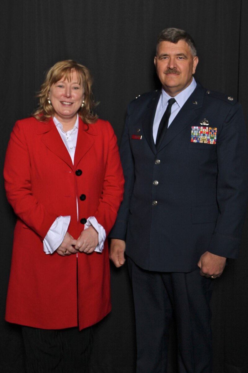 SIOUX FALLS, S.D. - Lt. Col. Kevin Callies, 114th Fighter Wing Comptroller, was honored during the Spirit of Volunteerism Award luncheon here May 8, 2012.  Callies was recognized as one of the Adult Spirit of Volunteerism Award winners for his extensive work with Junior Achievement of Sioux Falls.  Pictured with Lt. Col. Callies is Helpline Center Board President, Colleen Moran.(Photo provided by the Helpline Center)(Released)