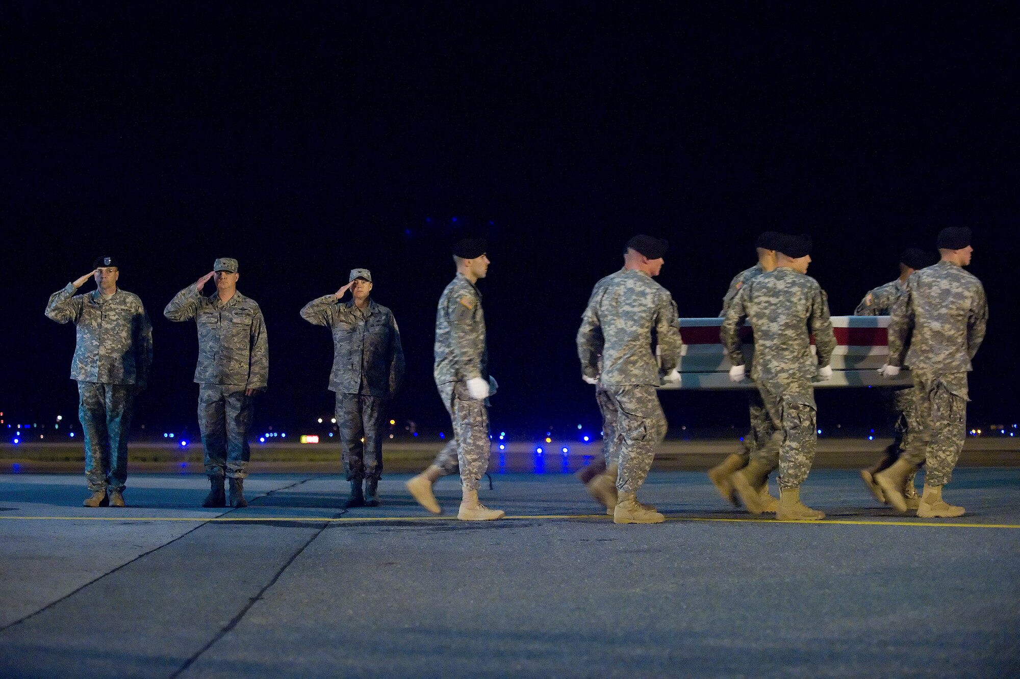 A U.S. Army carry team transfers the remains of Army 2nd Lt. Travis A. Morgado of San Jose, Calif., at Dover Air Force Base, Del., May 24, 2012. Morgado was assigned to the 5th Battalion, 20th Infantry Regiment, 3rd Stryker Brigade Combat Team, 2nd Infantry Division, Joint Base Lewis-McChord, Wash. (U.S. Air Force photo/Adrian R. Rowan)