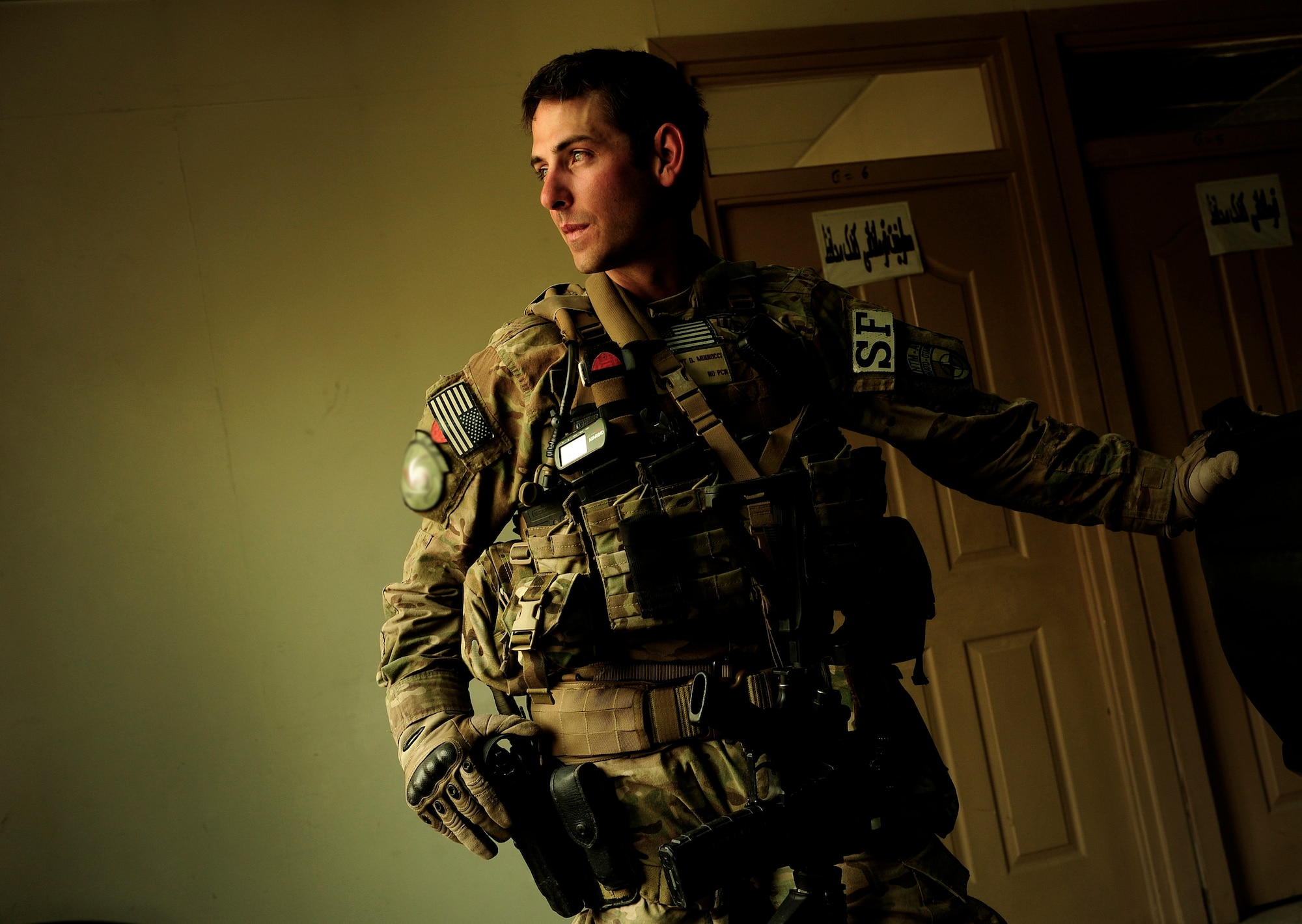 Air Force Capt. Dan Minnocci from the 439th Air Expeditionary Advisor Squadron sports two hats at his deployed location; he is both the security forces operational advisor and defense force commander in Kabul, Afghanistan, International Airport,May 21, 2012. Security Forces members from the 439th AEAS advise members of the AAF on mounted and dismounted operations in an effort to increase stability in Kabul.(U.S. Air Force photo/Staff Sgt. Clay Lancaster)