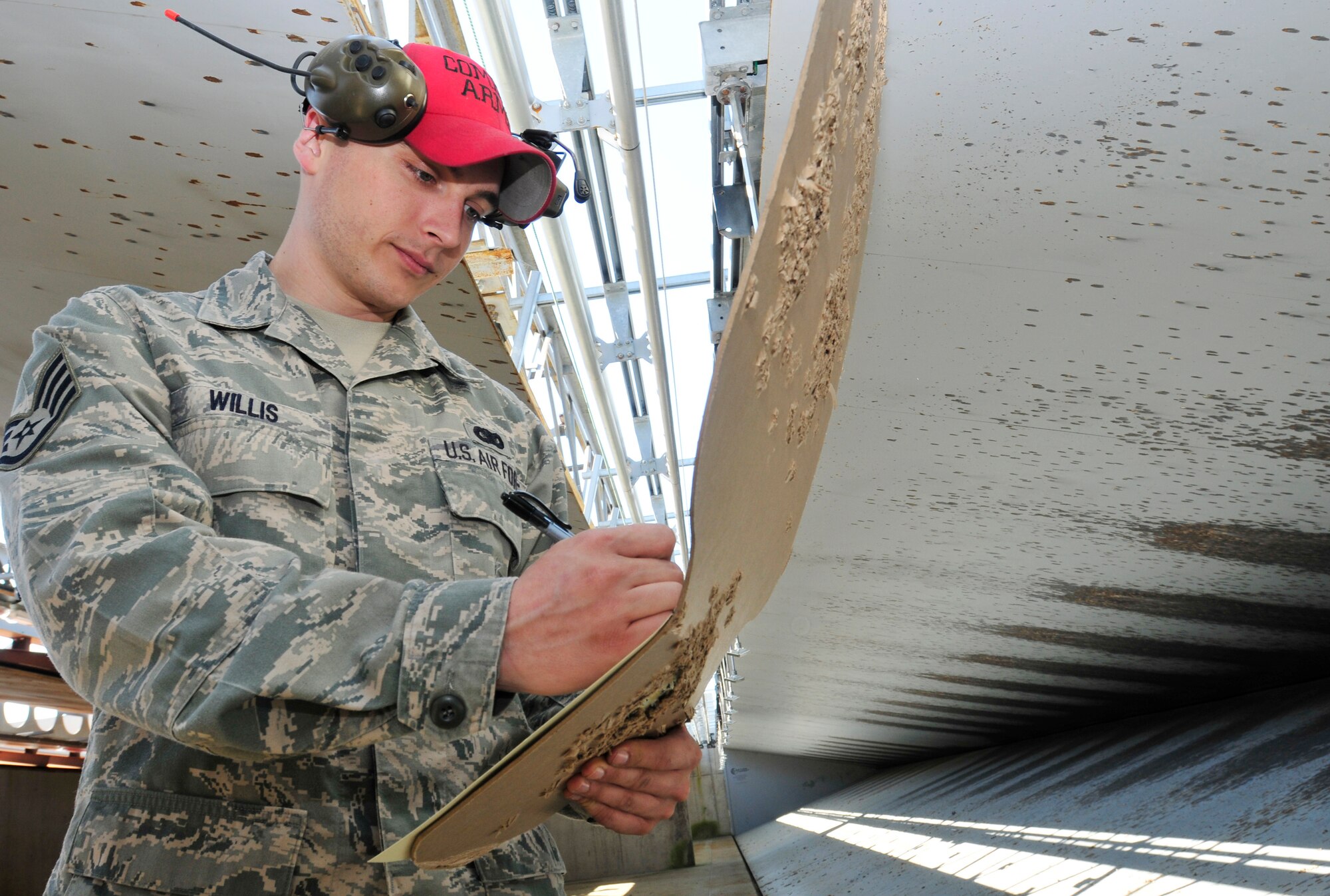 ROYAL AIR FORCE LAKENHEATH, England - Staff Sgt. Michael Willis, 48th Security Forces Squadron Combat Arms instructor, scores a target at the RAF Feltwell Firing Range May 25, 2012. Willis was nominated for a Liberty Spotlight because he displays the core value of "Excellence in All We Do." (U.S. Air Force photo by Senior Airman Tiffany M. Deuel)