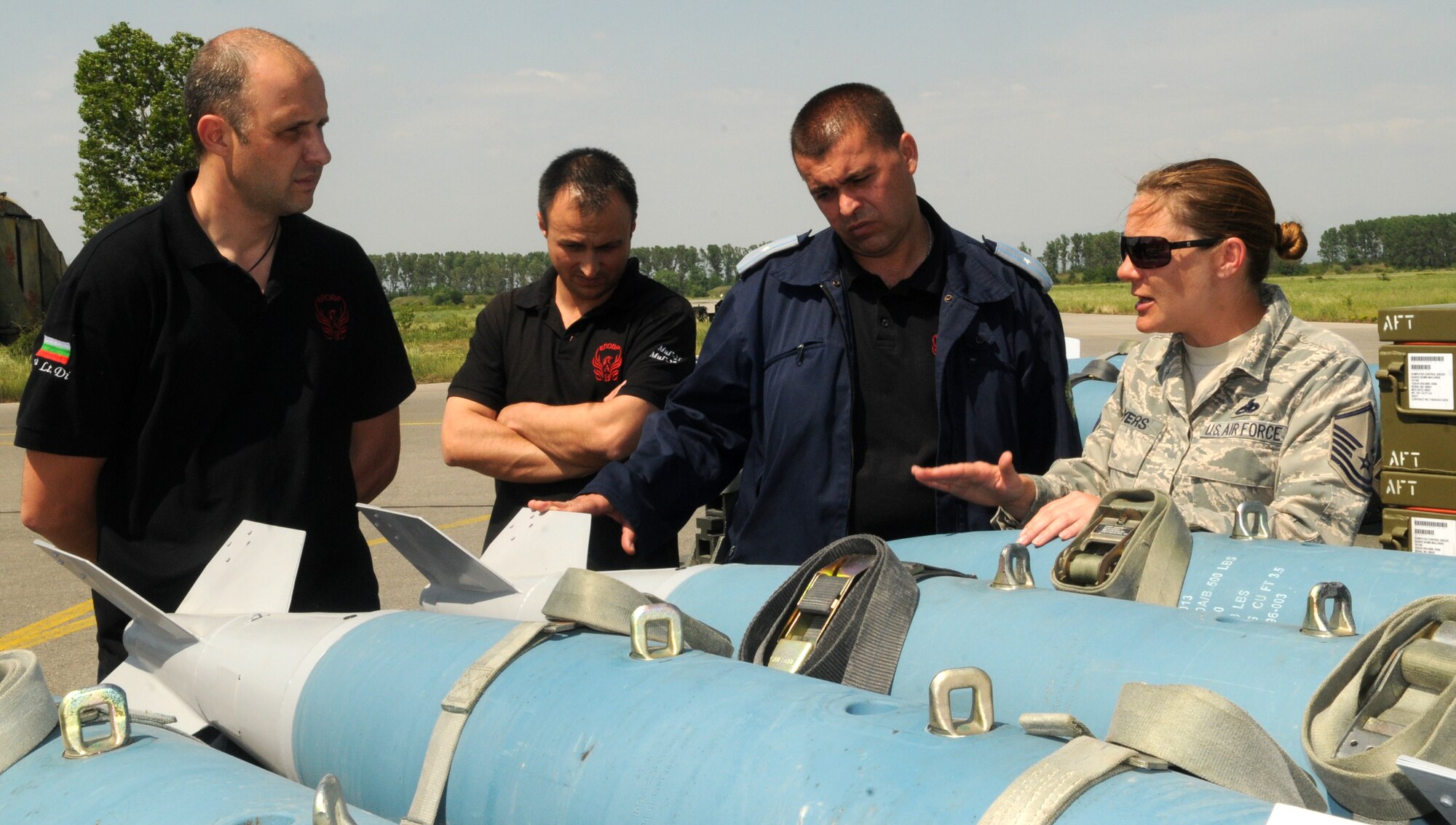 Master Sgt. Amanda Myers, 31st Munitions Squadron NCO-in-charge of munitions control, gives a briefing to Bulgarian military members May 3 at Graf Ignatievo Air Base, Bulgaria during Thracian Star 2012. The munitions, aircraft maintenance and maintenance operations squadrons worked jointly during the exercise, building and loading bombs and ammunition to be used for air-to-ground sorties, during which 536 bombs were dropped and 9,250 rounds of 20 millimeter ammunition were expelled at the local range. (U.S. Air Force photo/ 2nd Lt. Joseph Alonso)