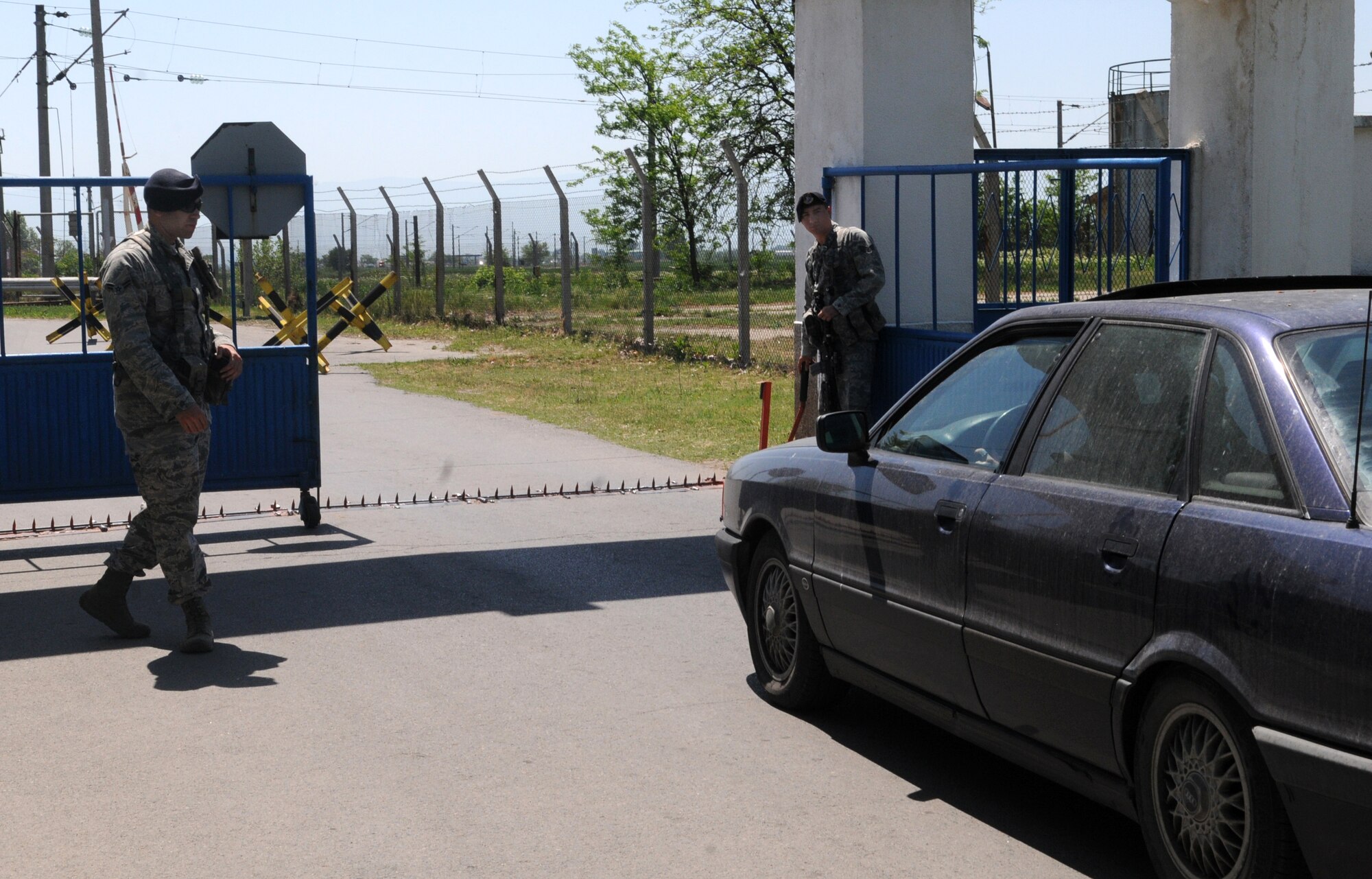 Entry controllers from the 31st Security Forces Squadron man the gate April 25 at Graf Ignatievo Air Base, Bulgaria during exercise Thracian Star 2012. Throughout the exercise, American and Bulgarian Airmen worked hand-in-hand to keep the installation secure. (U.S. Air Force photo/ 2nd Lt. Joseph Alonso)