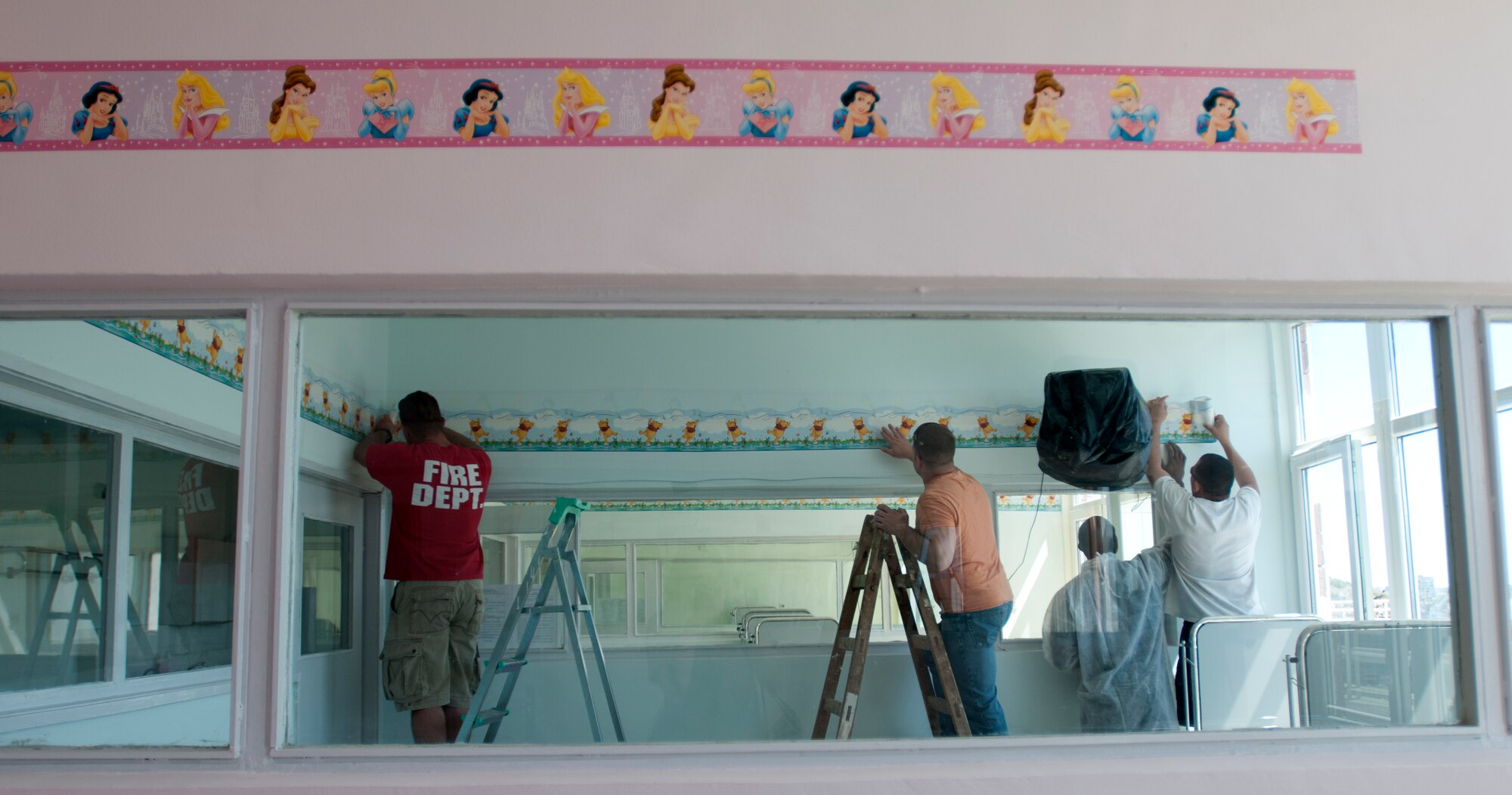 American and Bulgarian volunteers paint a post-operation room in the St. George's University pediatric surgery ward April 22 in Plovdiv, Bulgaria. More than 60 U.S. and Bulgarian air force members volunteered to renovate the children’s ward during their off-duty time from the Thracian Star 2012 exercise being conducted at Graf Ignatievo Air Base. The volunteers spent two days cleaning, painting and decorating 11 rooms in the ward. (U.S. Air Force photo/Senior Airman Katherine Windish)