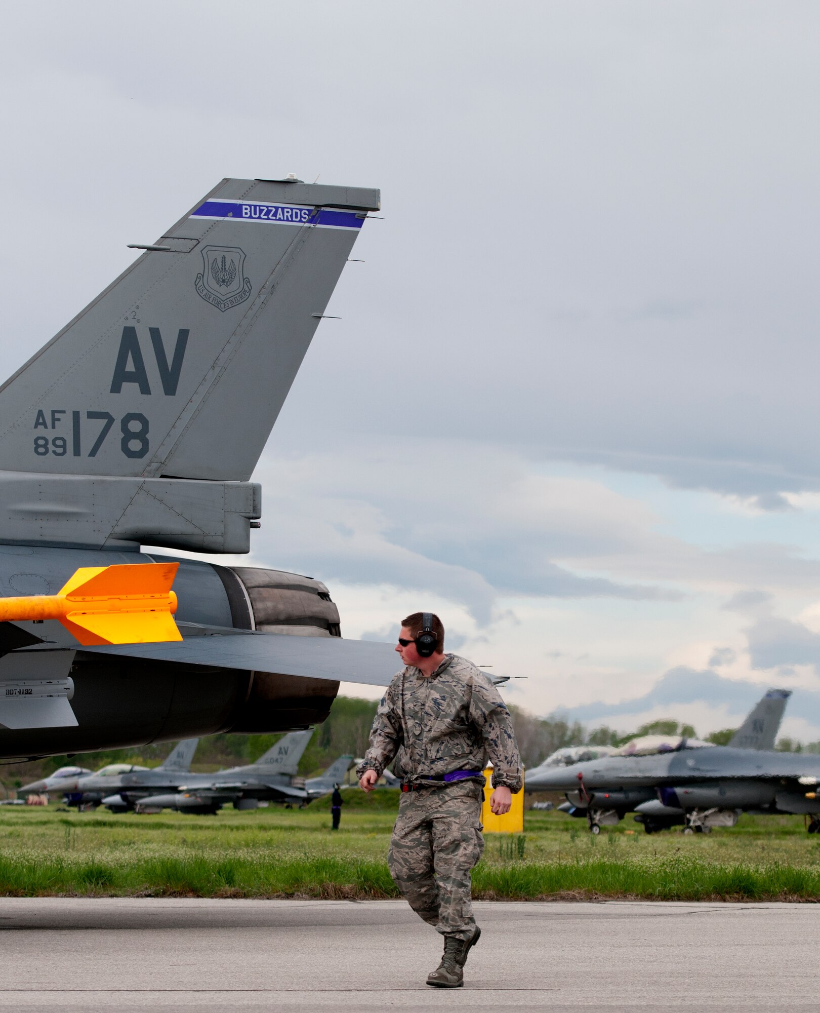 Airman 1st Class Adam Geroulis, 31st Aircraft Maintenance Squadron weapons load crew member, inspects munitions after loading them onto an F-16 Fighting Falcon May 20 at Graf Ignatievo Air Base, Bulgaria, during Thracian Star 2012. Weapons loaders loaded more than 500 bombs during the coalition training exercise. (U.S. Air Force photo/Senior Airman Katherine Windish)