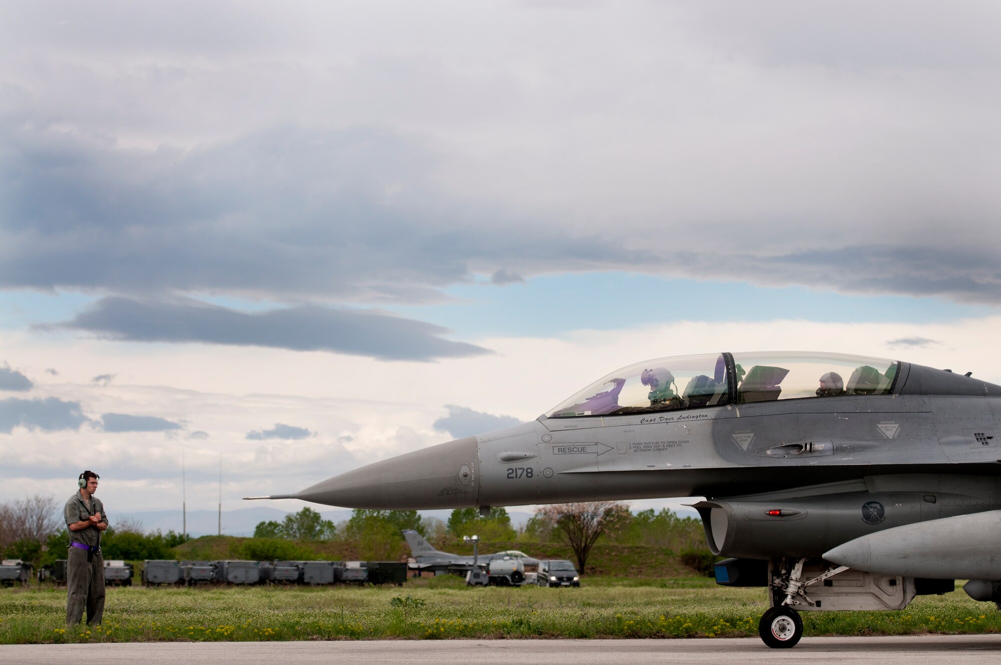 Staff Sgt. Alexander Wieczorek, 31st Aircraft Maintenance Squadron crew chief, prepares a 510th Fighter Squadron pilot for a launch May 20 at Graf Ignatievo Air Base, Bulgaria, during Thracian Star 2012. Aircraft maintainers spent six or more hours performing post-flight maintenance on F-16s after each of the 556 sorties launched during the coalition training exercise. (U.S. Air Force photo/ Senior Airman Katherine Windish)