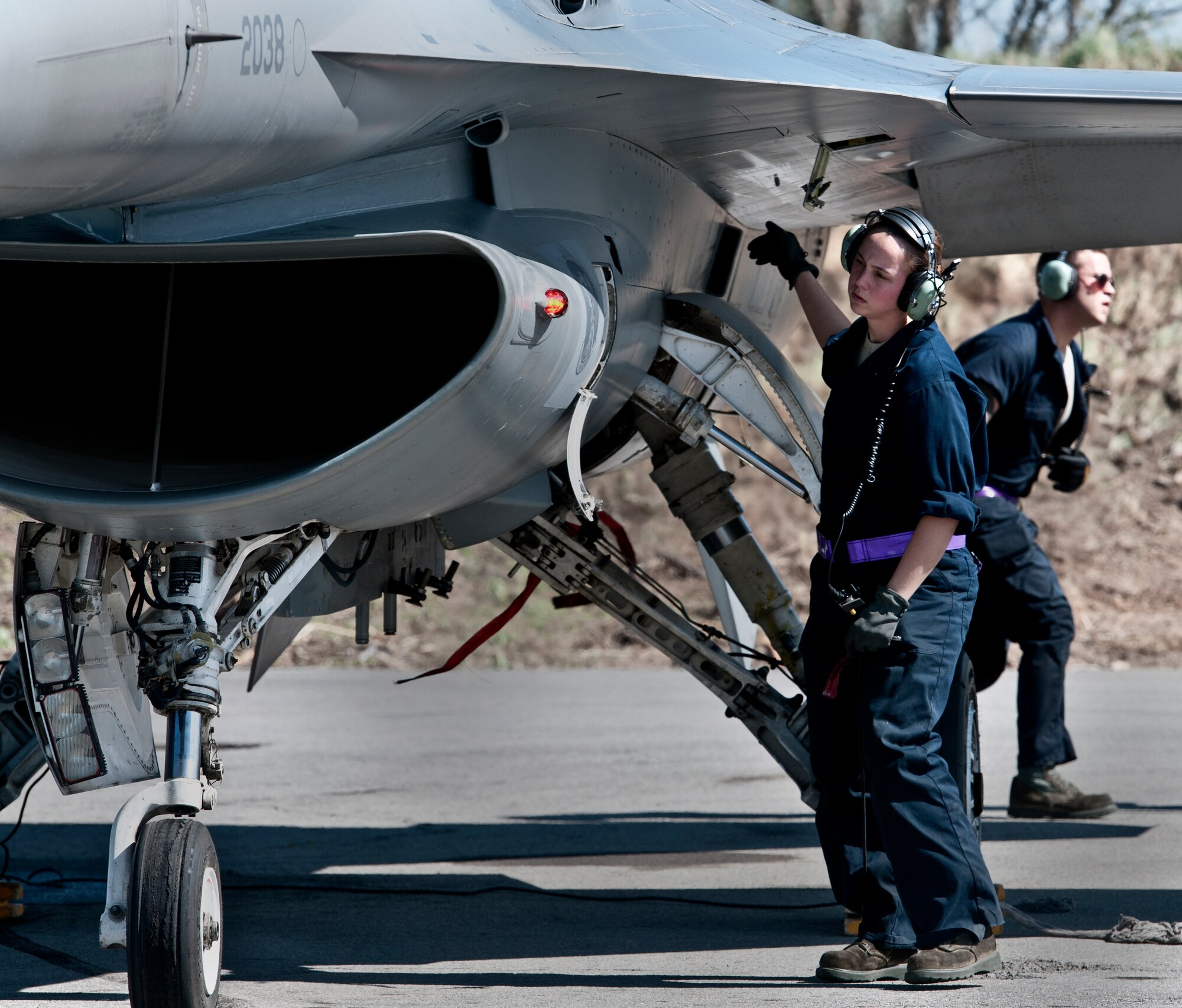 Senior Airman Annmarie Ringer, 31st Aircraft Maintenance Squadron crew chief, performs post-flight maintenance on an F-16 May 19 at Graf Ignatievo Air Base, Bulgaria, during Thracian Star 2012. More than 500 U.S. Airmen and two dozen F-16 Fighting Falcons from the 31st Fighter Wing here recently returned from a deployment to Bulgaria where they spent a month conducting bi-lateral training with Bulgarian Airmen. (U.S. Air Force photo/Senior Airman Katherine Windish) 