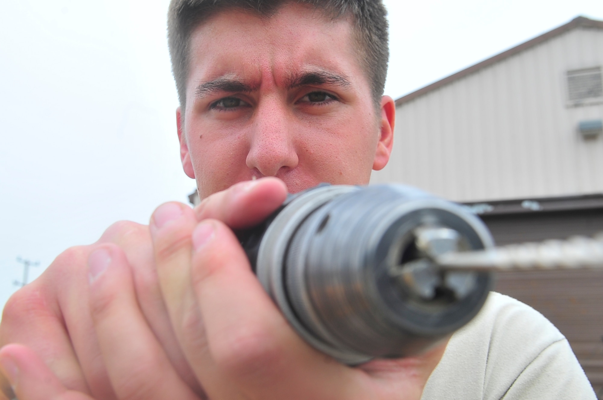 U.S. Air Force Academy Cadet Michael DePauw, drills pilot holes into walls of a storage shed, May 24, 2012. Cadets from the Air Force Academy are civil engineer students who will eventually lead teams of technicians like the CE Airmen at Osan. (U.S. Air Force photo/Senior Airman Adam Grant)      