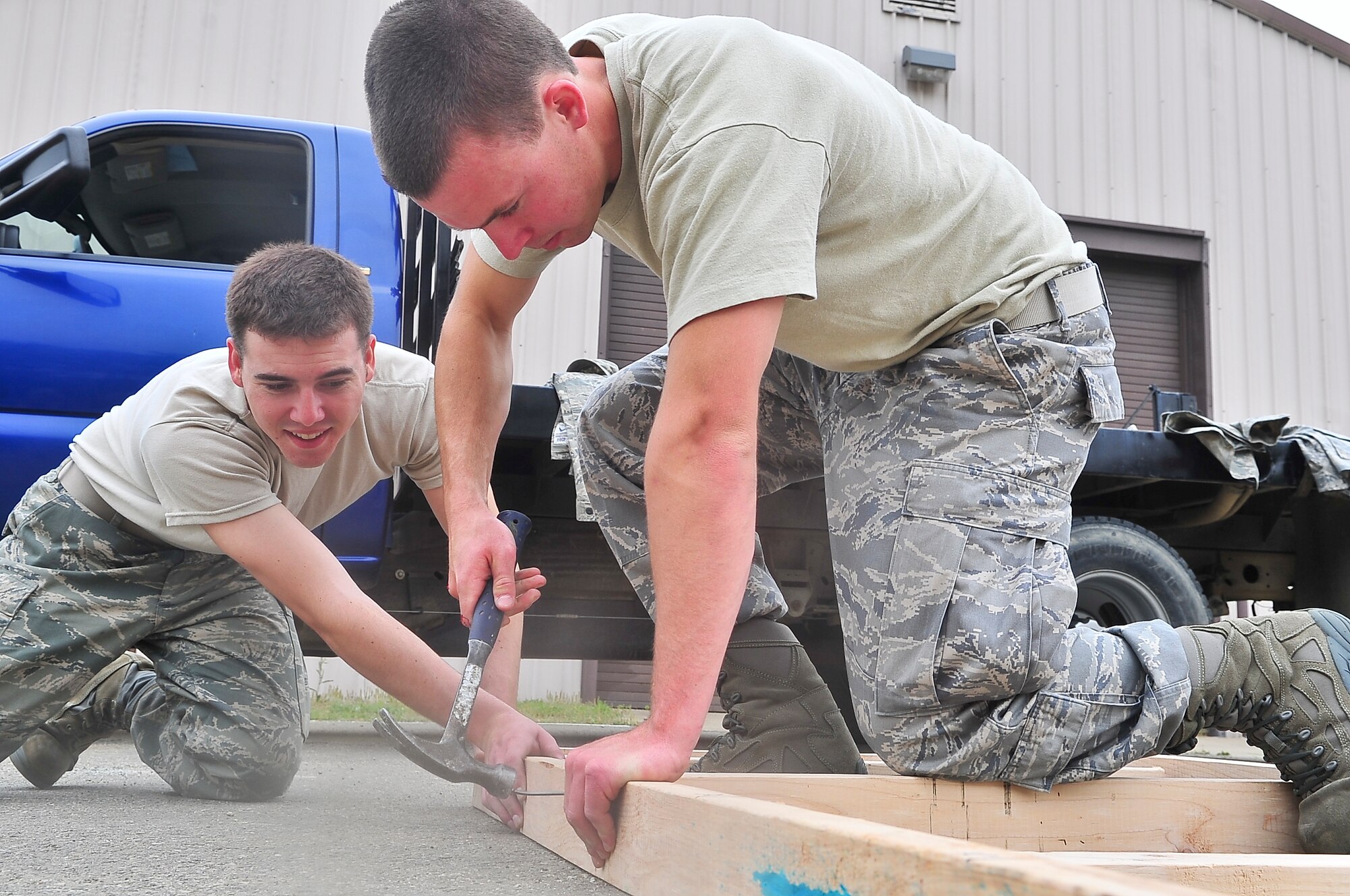 U.S. Air Force Academy cadets work with the 51st Civil Engineer Squadron’s Prime Base Engineer Emergency Force to frame up a storage shed May 24, 2012. Approximately 15 cadets came here to participate in a two-week summer program for junior and senior cadets to experience what the active duty Air Force is like. (U.S. Air Force photo/Senior Airman Adam Grant)   