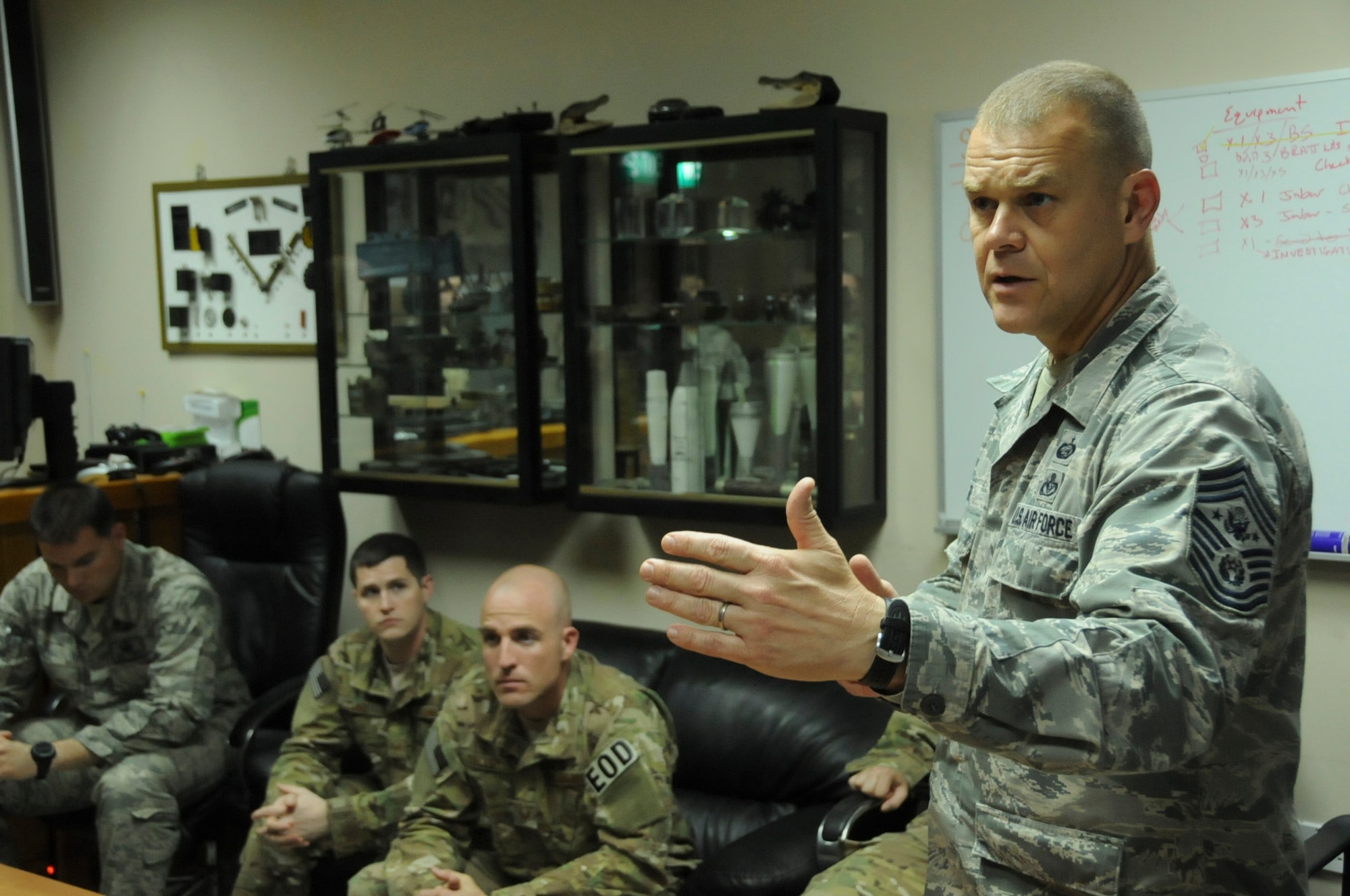 Chief Master Sgt. of the Air Force James Roy visits with explosive ordnance disposal specialists from the 386th Expeditionary Civil Engineering Squadron at an undisclosed location in Southwest Asia, May 21, 2012. Roy was visiting with the deployed Airmen to discuss issues, challenges, and concerns that are currently facing the United States Air Force and its personnel. (U.S. Air Force photo by Staff Sgt. James Lieth/Released)